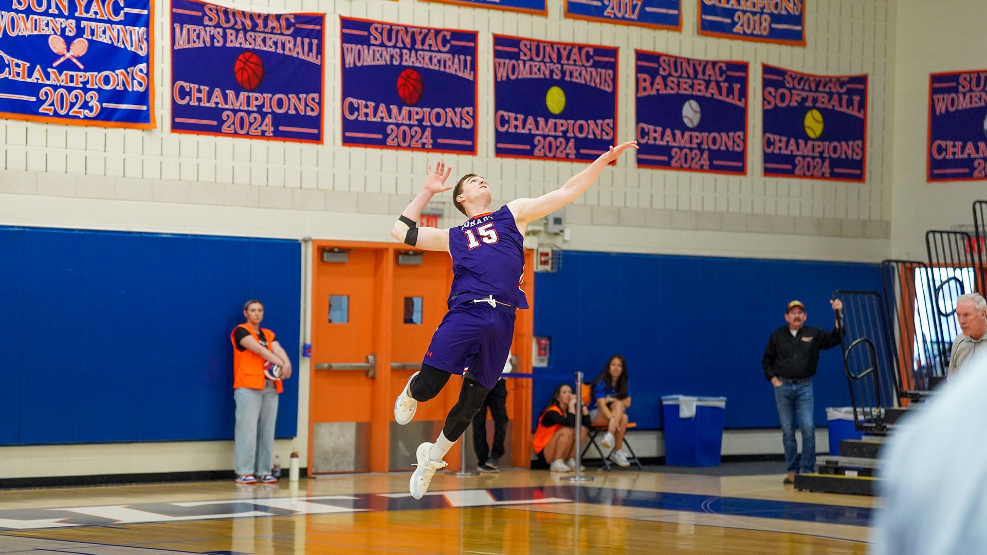 Noah DeLong serving against New Paltz