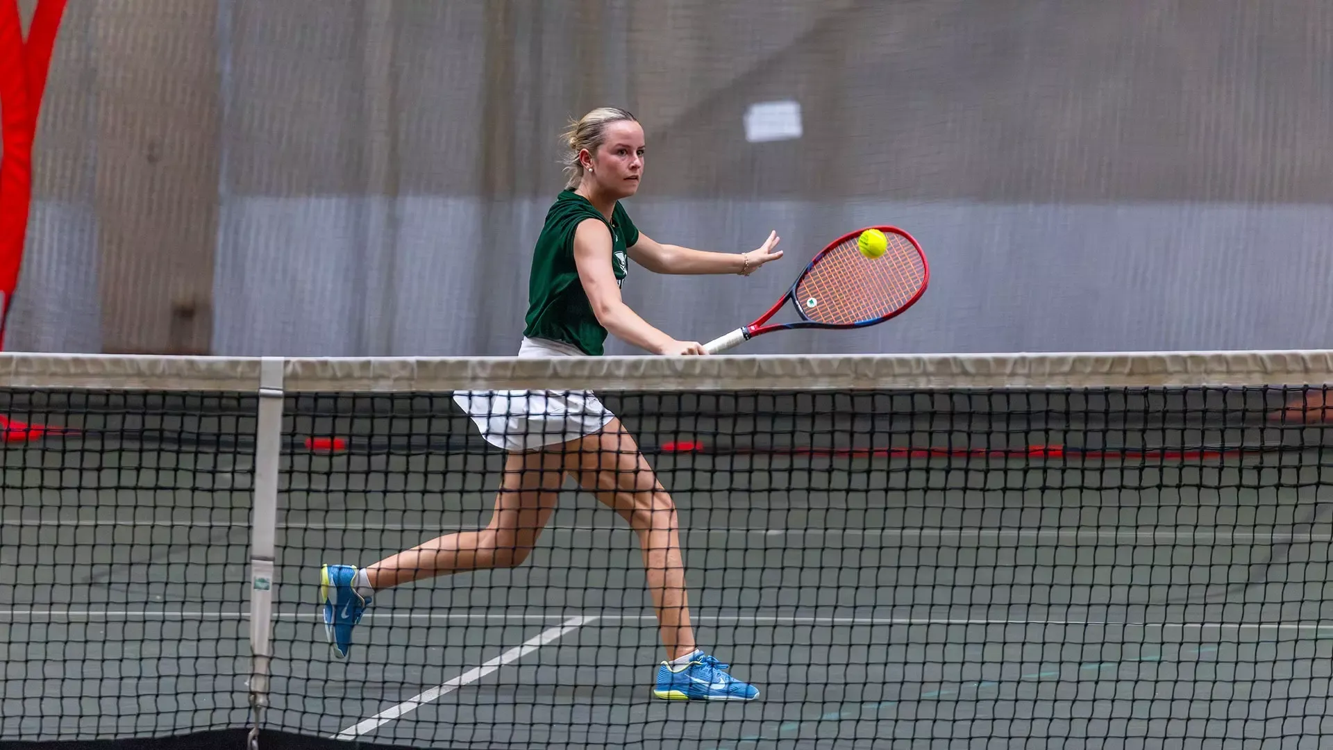 Grace Magna hits a backhand slice