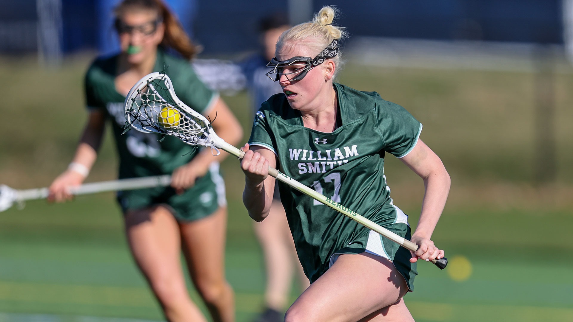 Caitie Baker runs the ball downfield. 