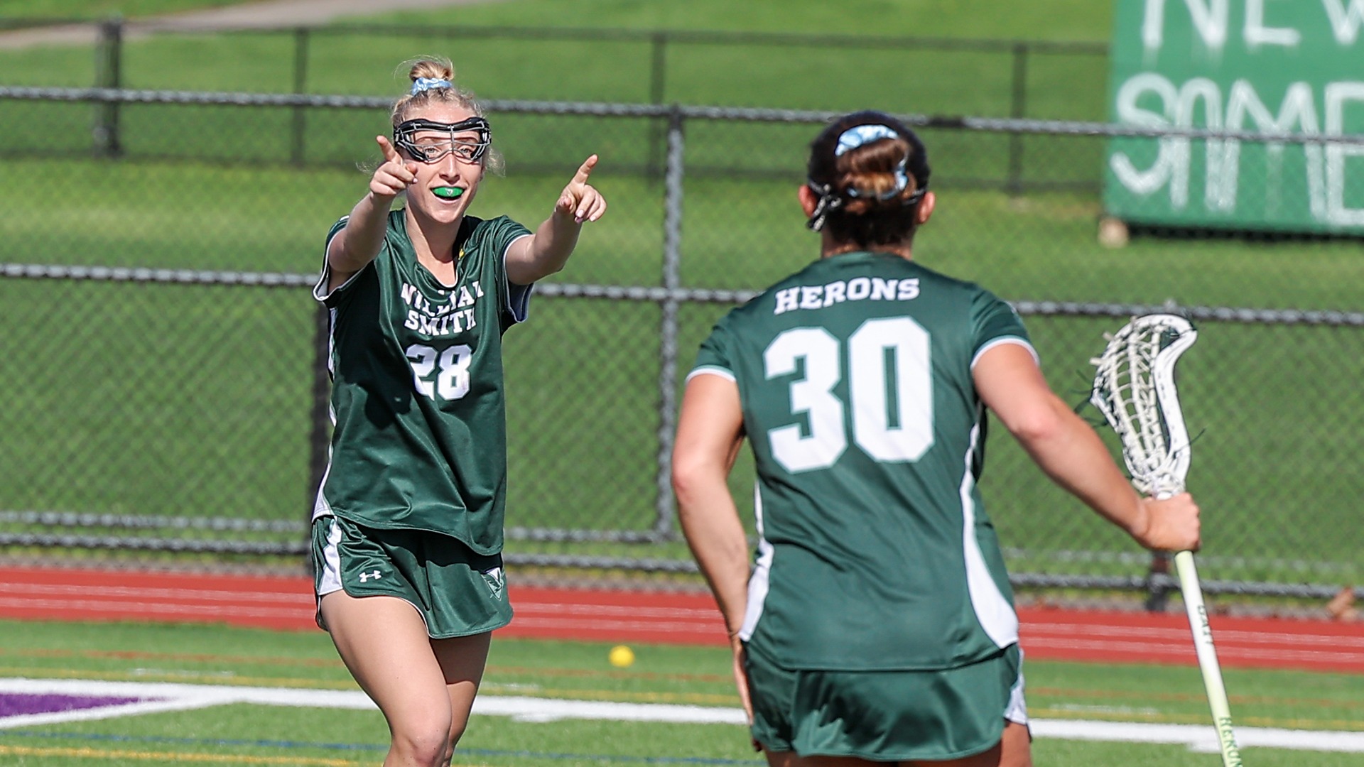 Katie Grottenthaler and Mia Falco following 99th career points