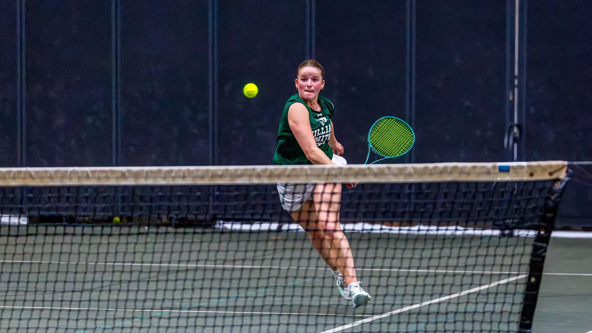 Mia Jacobs runs to hit a backhand slice