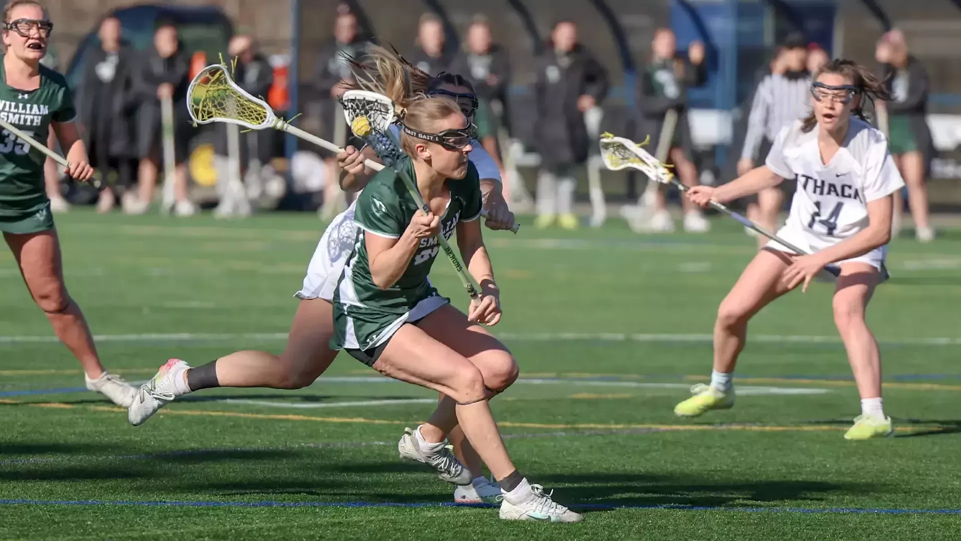 Grace Rund attempts to run past an Ithaca defender