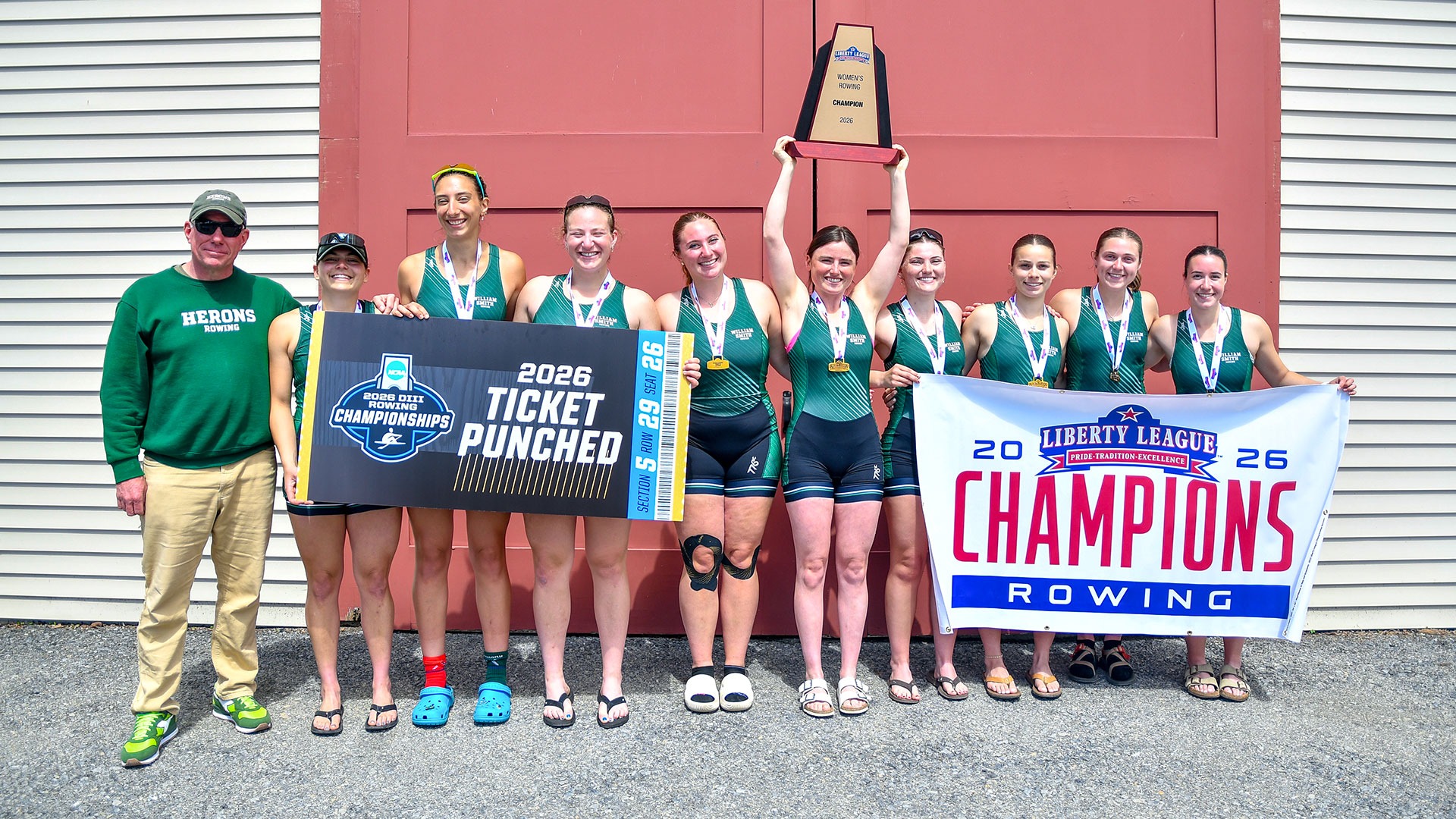 The First Varsity eight pose with the Liberty League Trophy