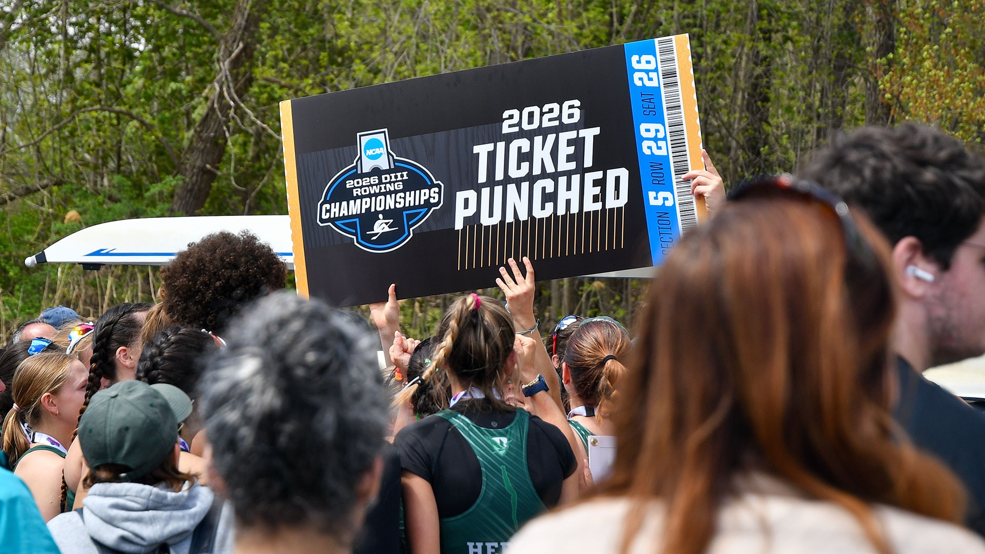 The Herons Celebrate with NCAA Ticket Punched Sign