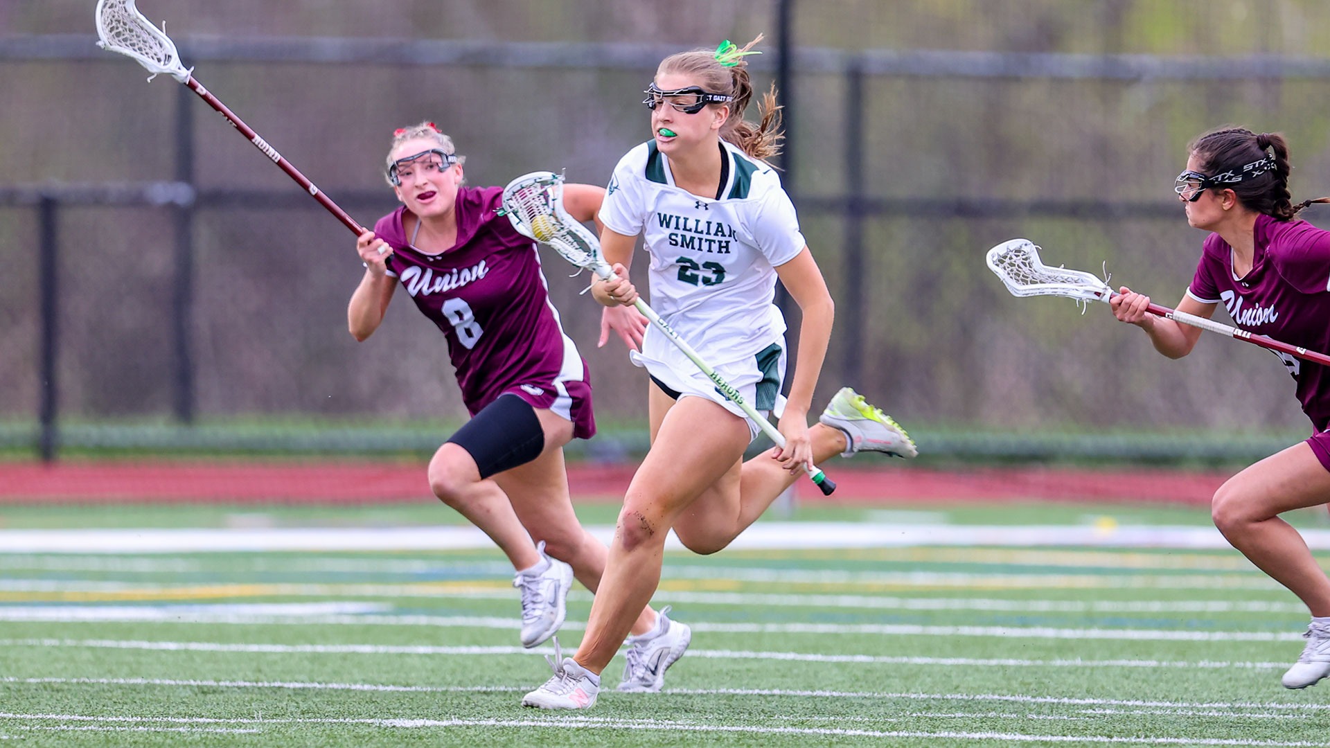 Janey Sypeck carries the ball out of the defensive end of the field