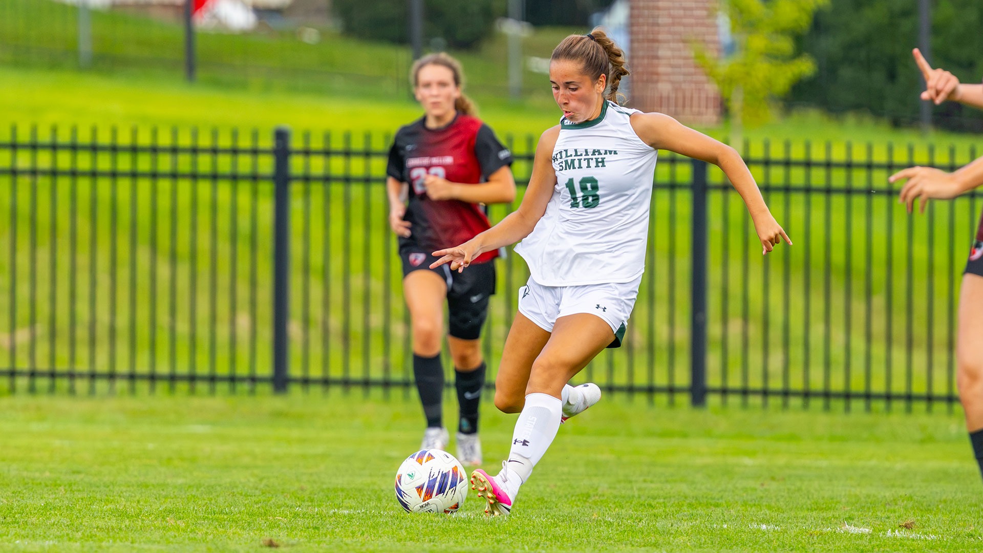 Grace Sudbay kicks the ball downfield against Carnegie Mellon