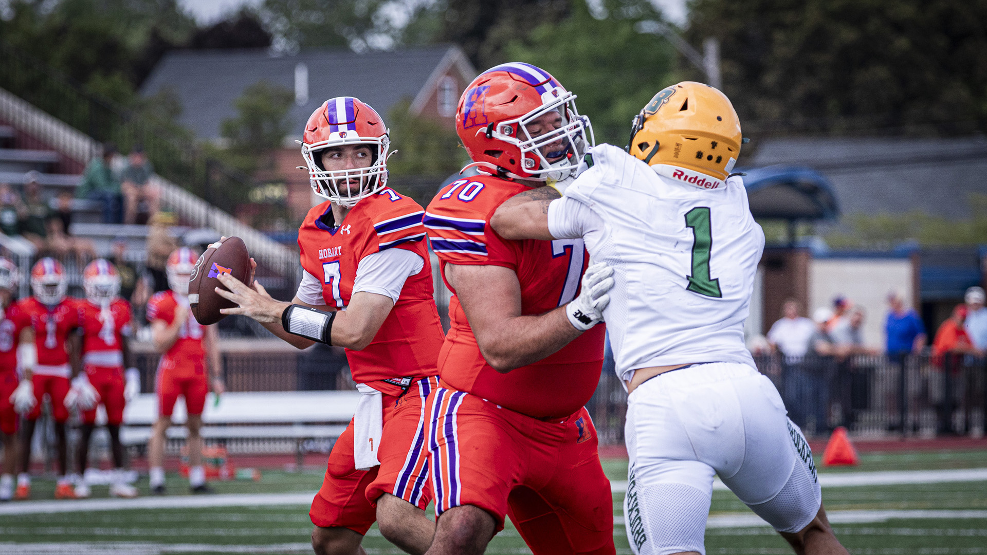 Jake Jeffay (#70) provides protection for quarterback Aidan Conrath (#7).