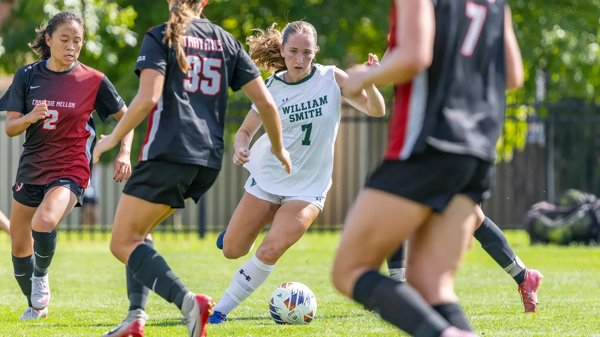 Kristin Middaugh dribbles through defenders