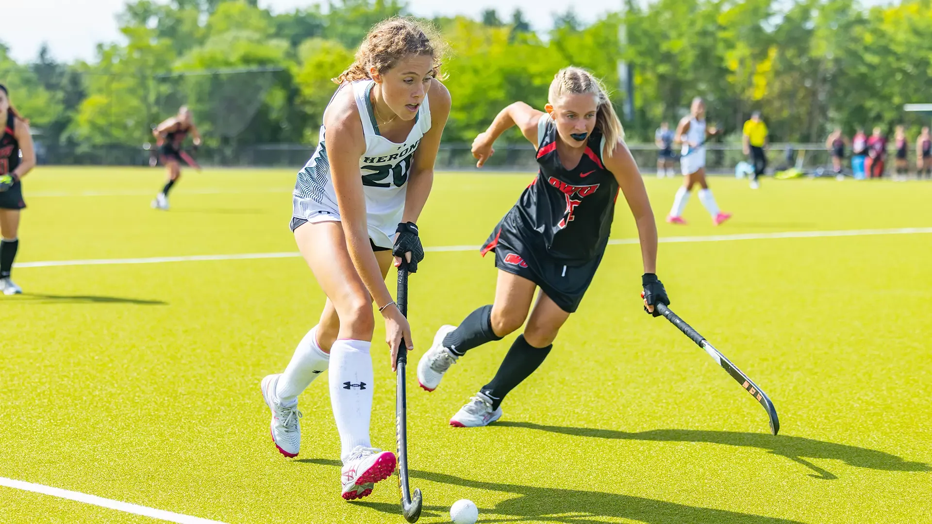 Grace McCormick sneaks between the defender and sideline 