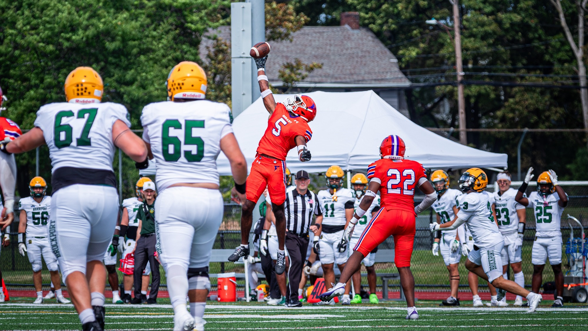 Zeshan Dixon makes a leaping, one-handed interception against Brockport.