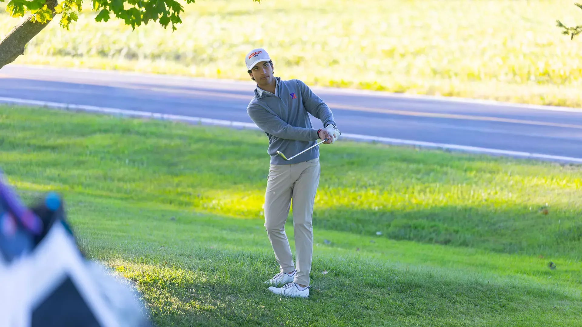 Aman Dhiman chips in from the rough