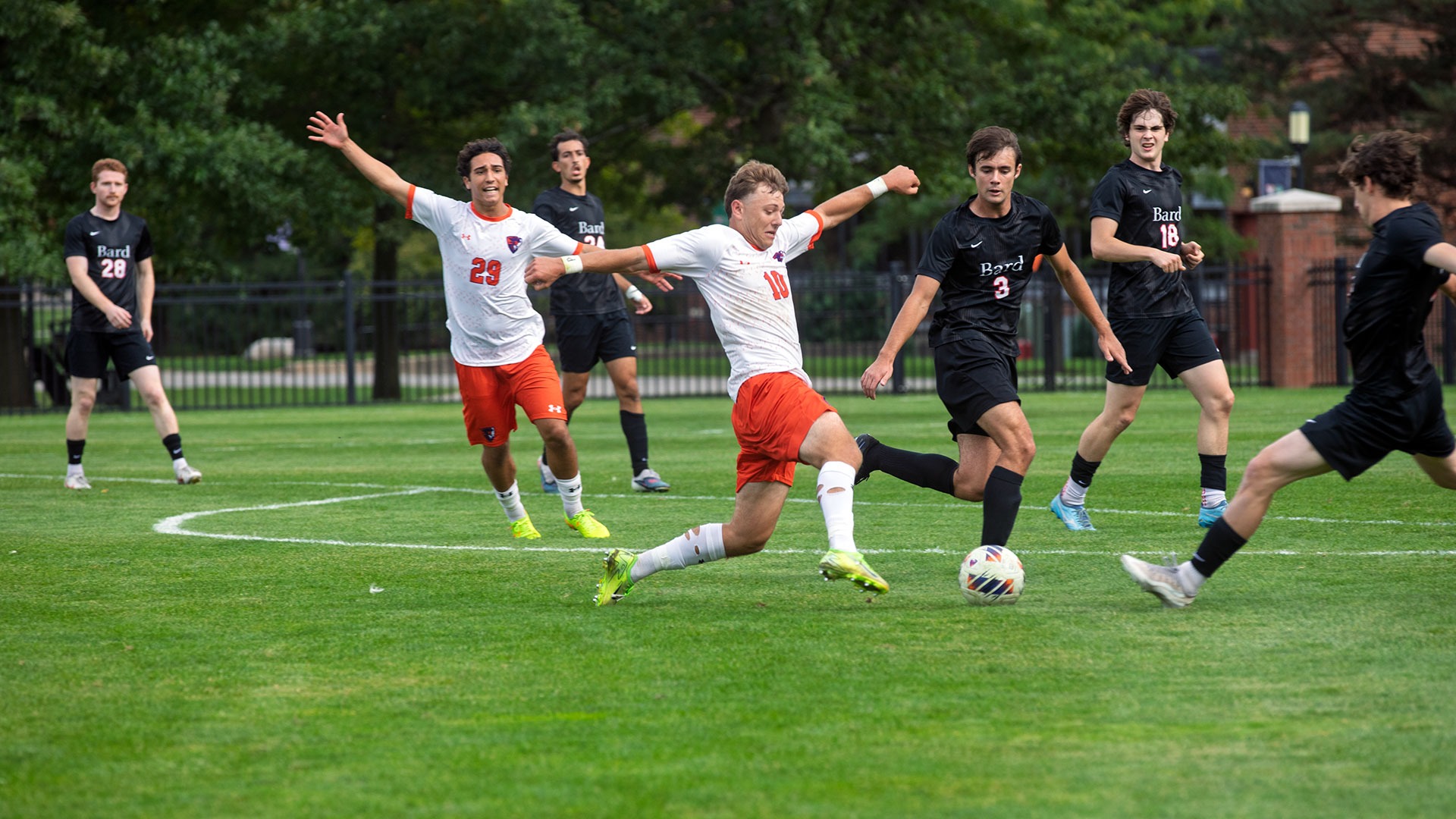Brady Leitner pokes a ball away from a Bard defender