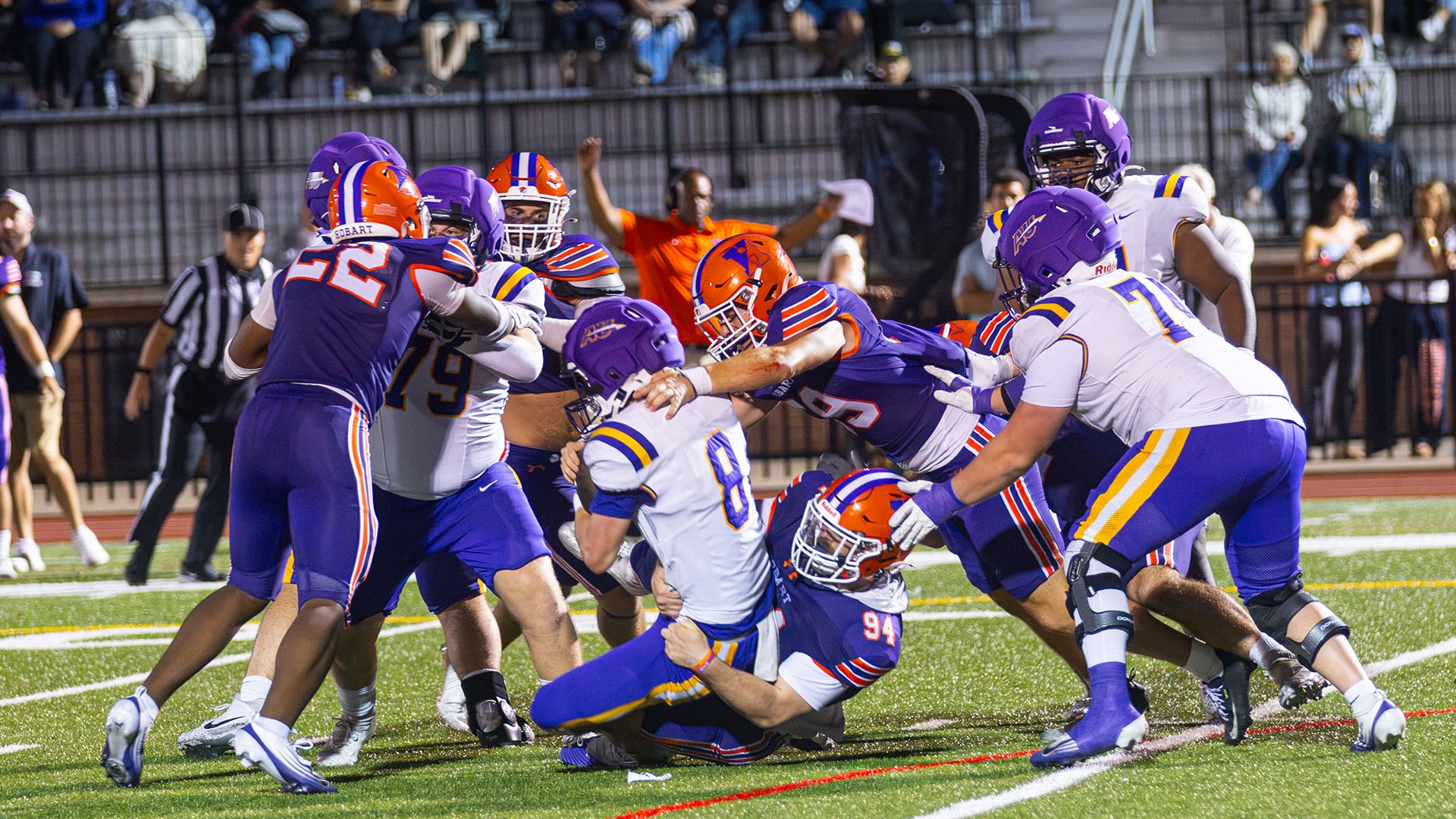 Billy Brosko (#94) wraps up the Alfred quarterback.