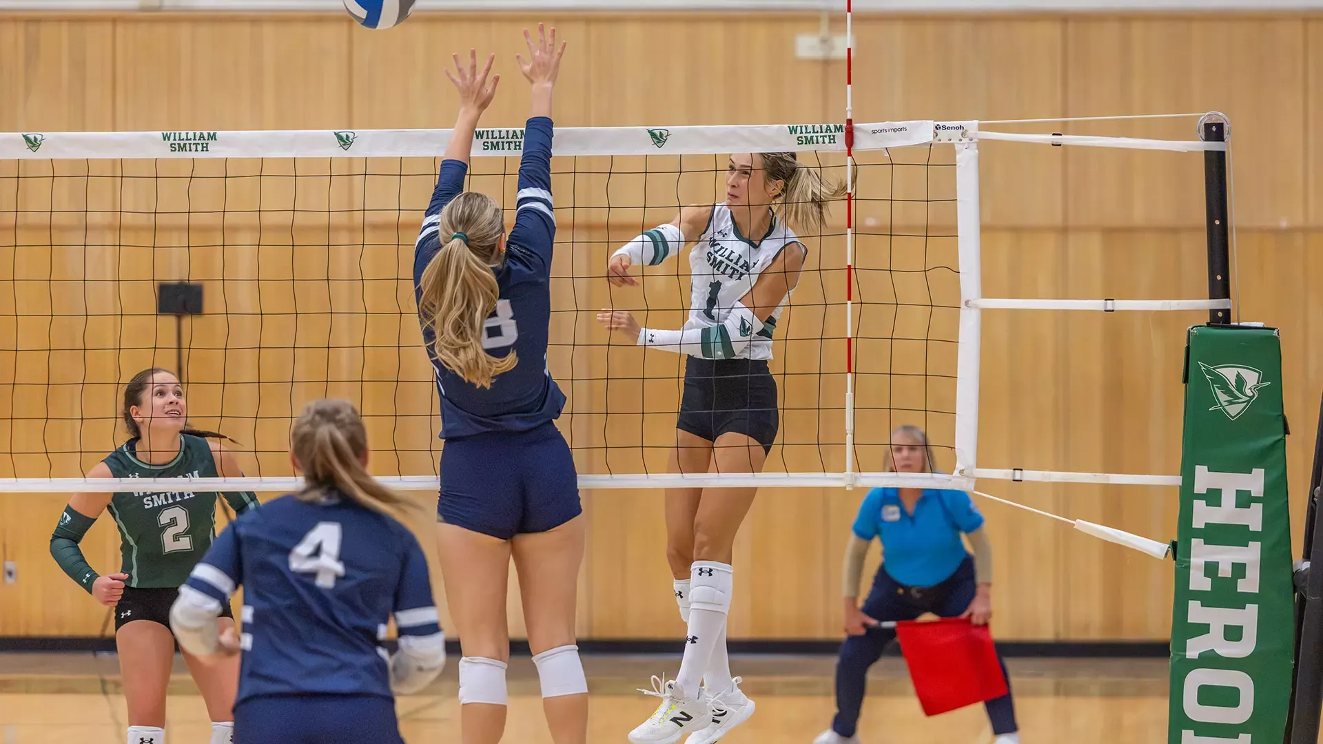 Cassidy Breuer hits the ball right past opponents and over the net