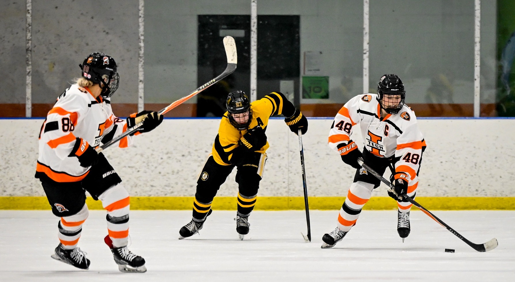 Greene and Johnson work up the ice 