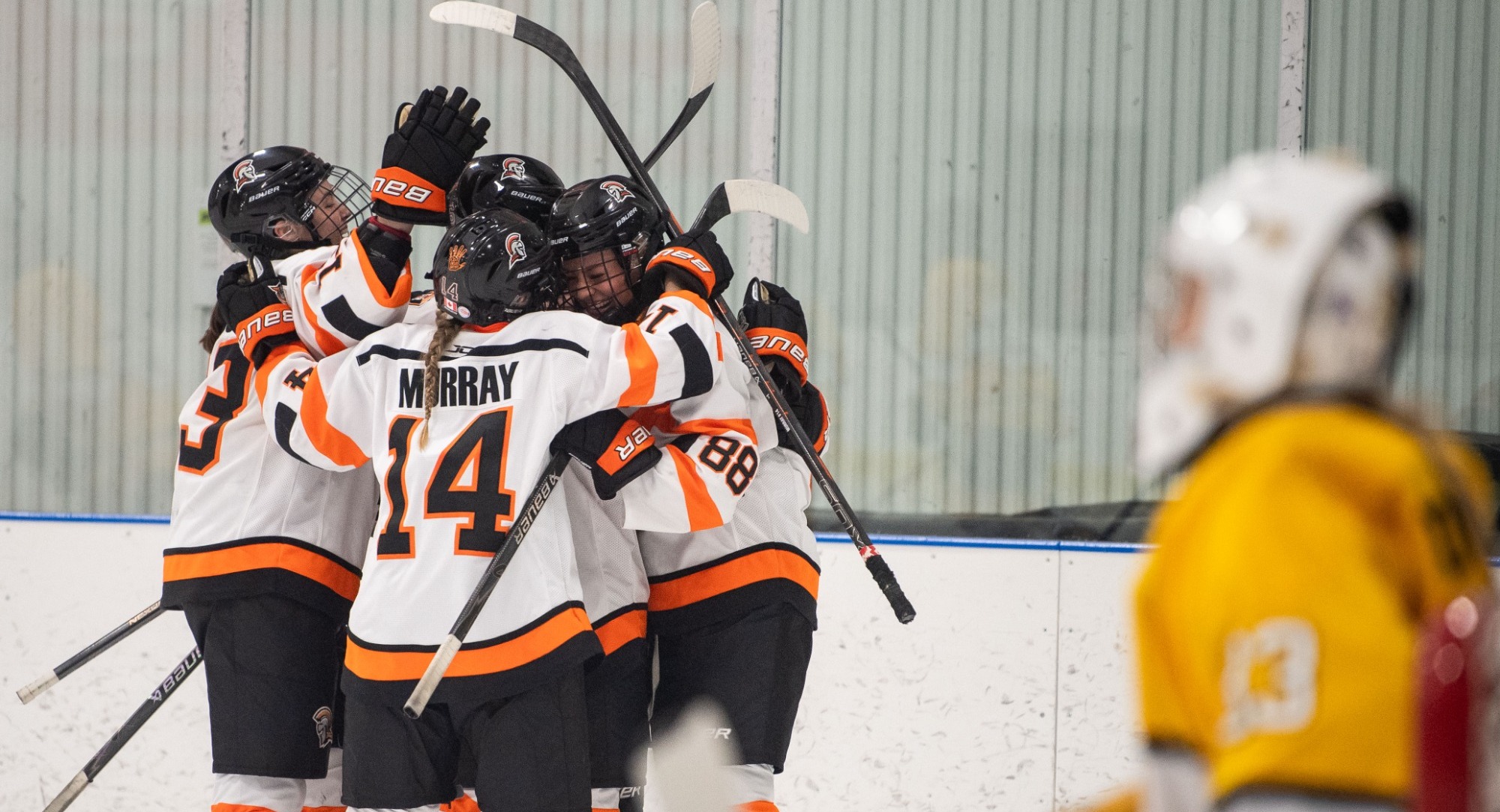 Team embraces after scoring 
