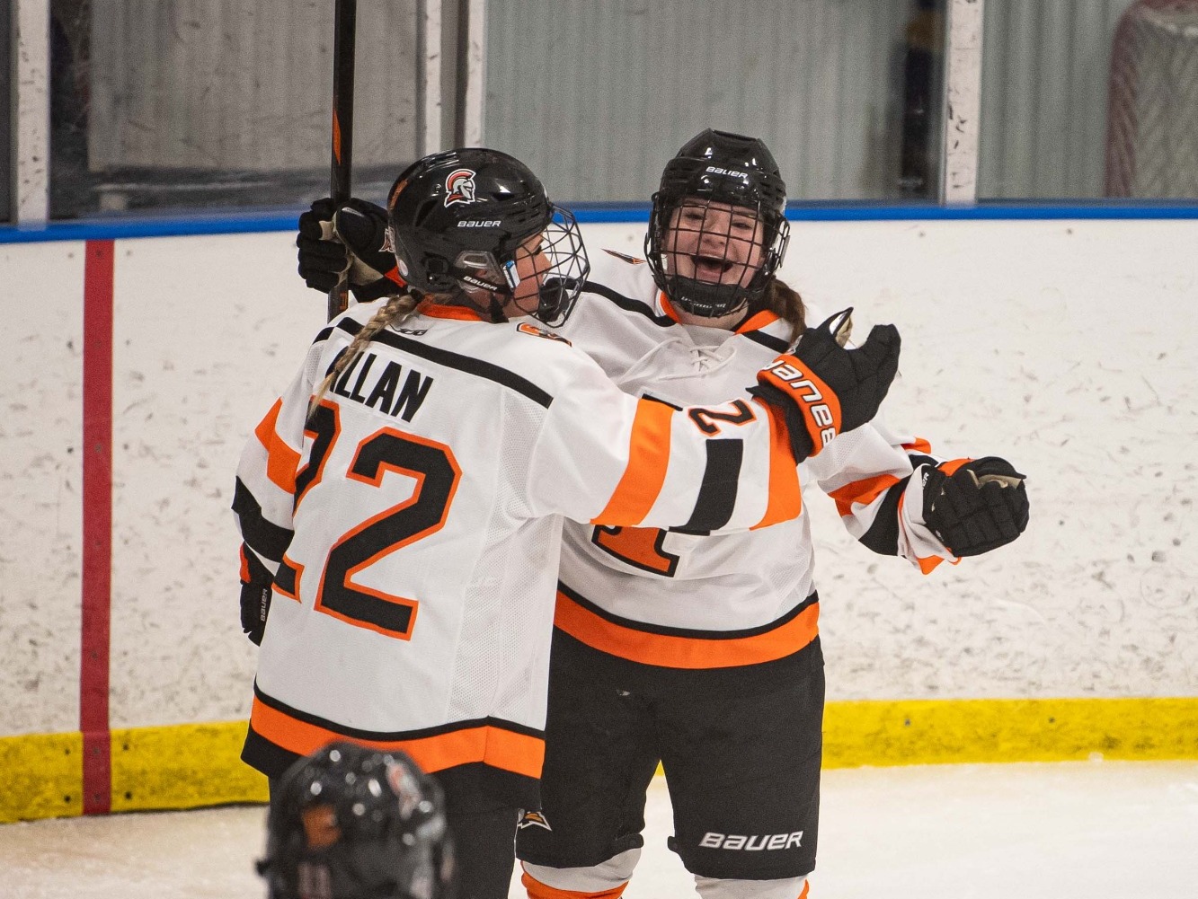Grenier embraced by Allen after goal 