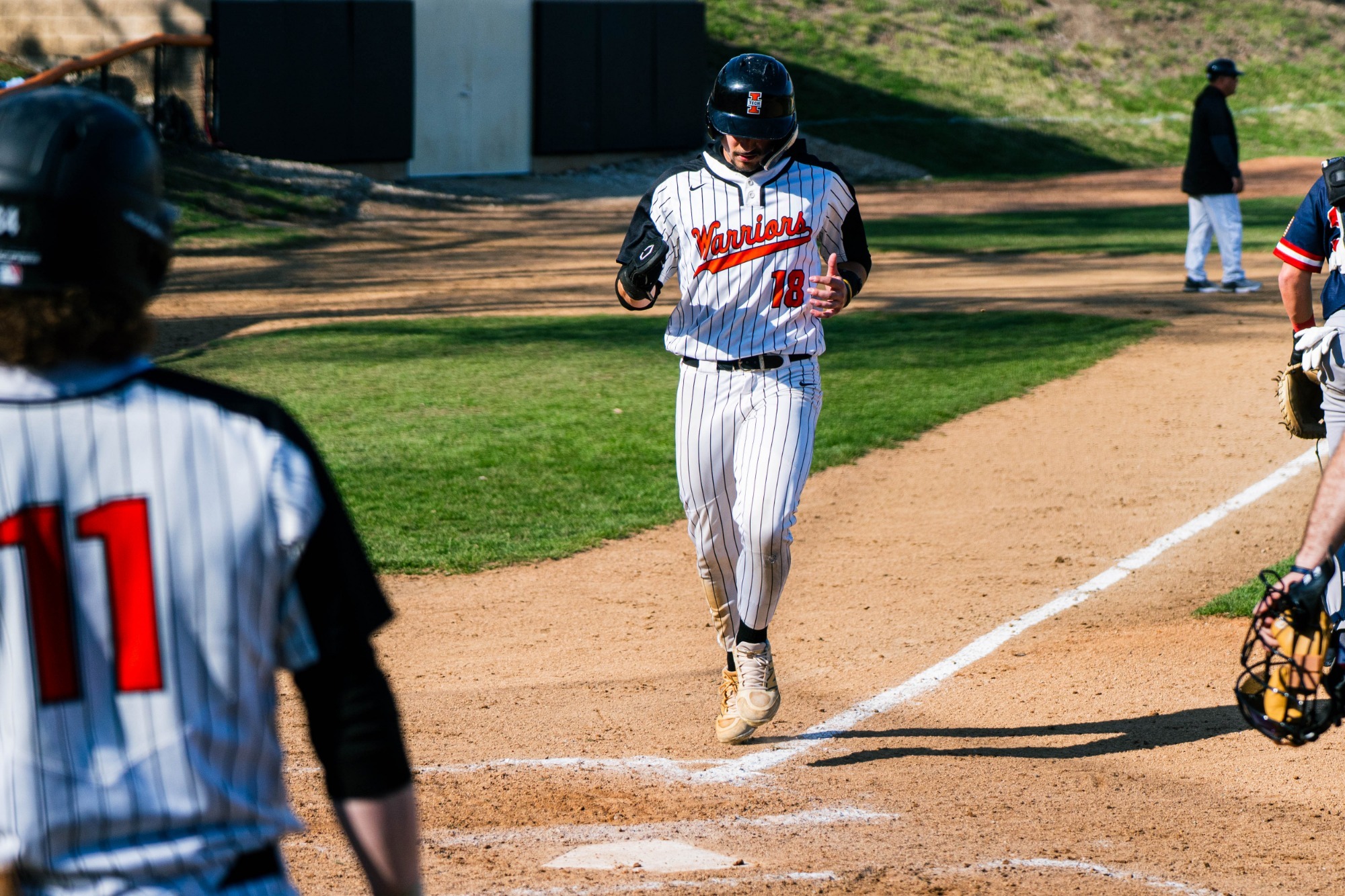 garrett rainey touching home plate 