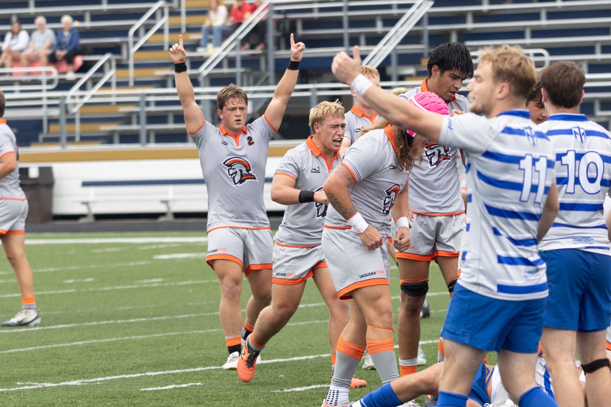 Max Brinker and Teammates celebrate vs Thomas More