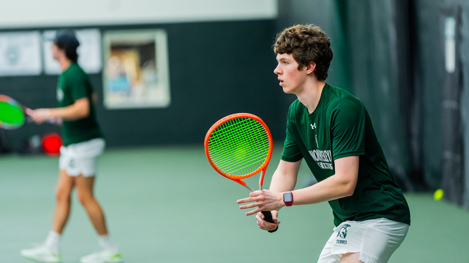 Chase Tomecki readying for a serve during practice 2025
