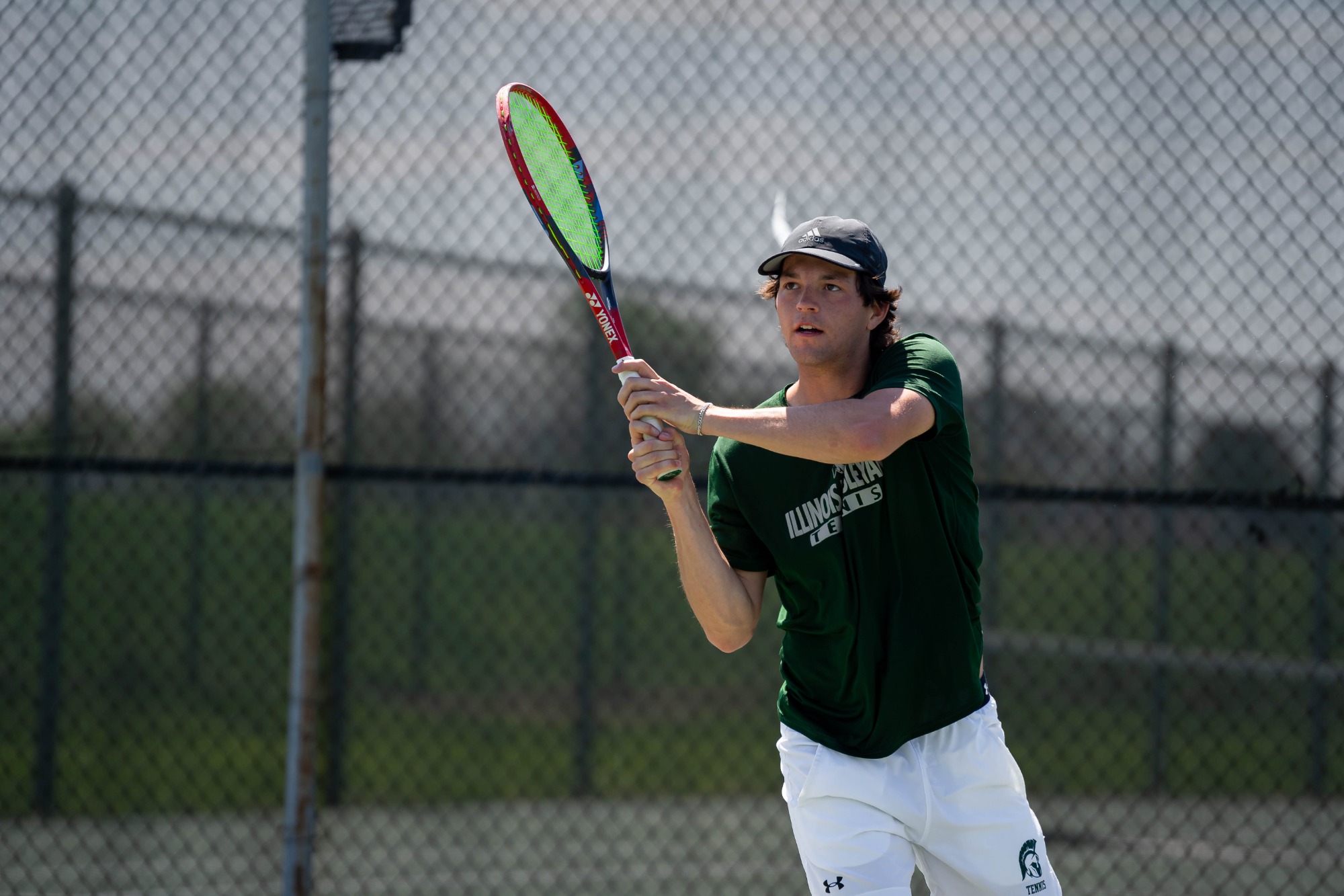 Griffin Hammond returning a shot