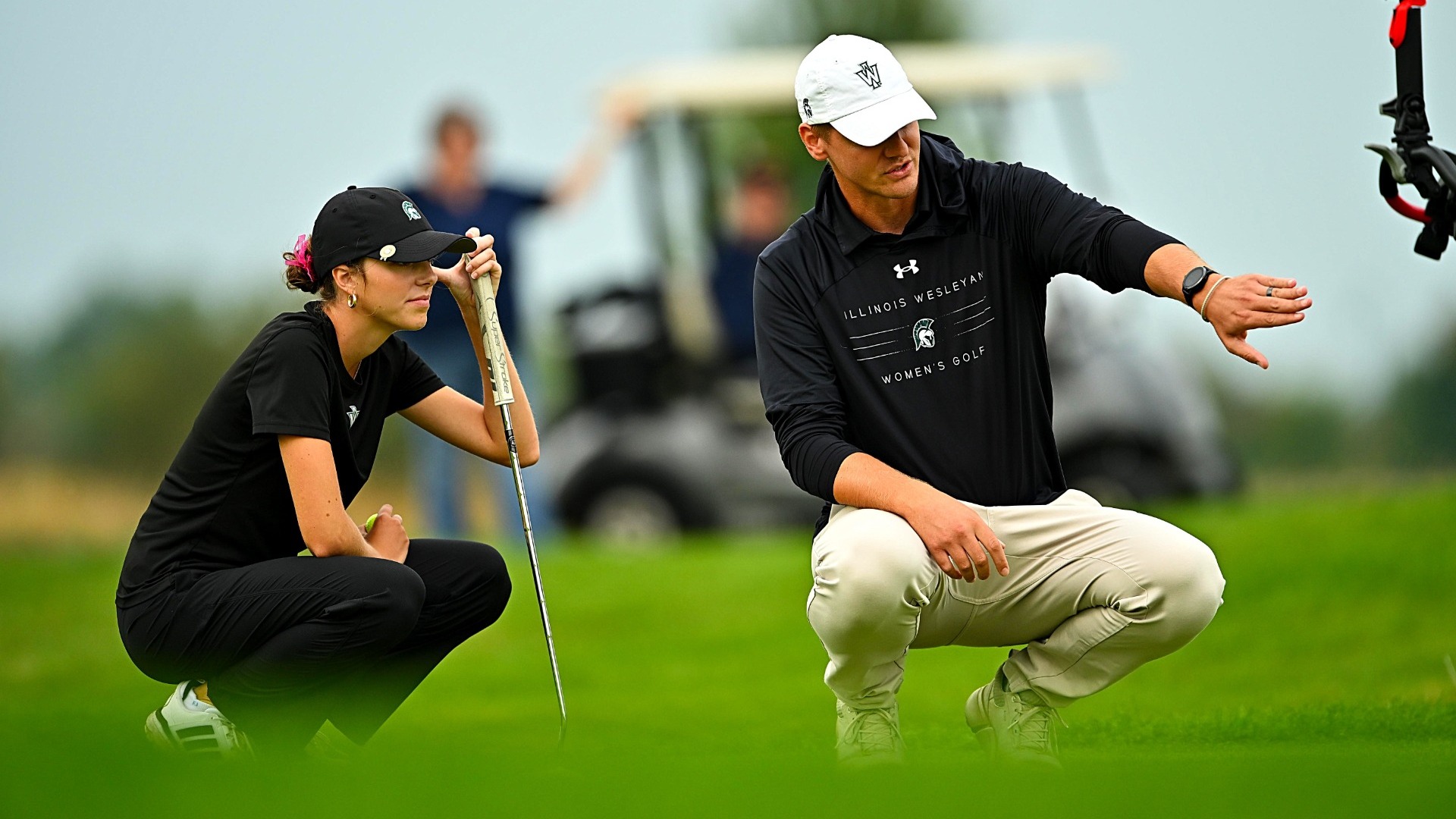 Natalie Ocheltree & Patrick Freeman line up a putt