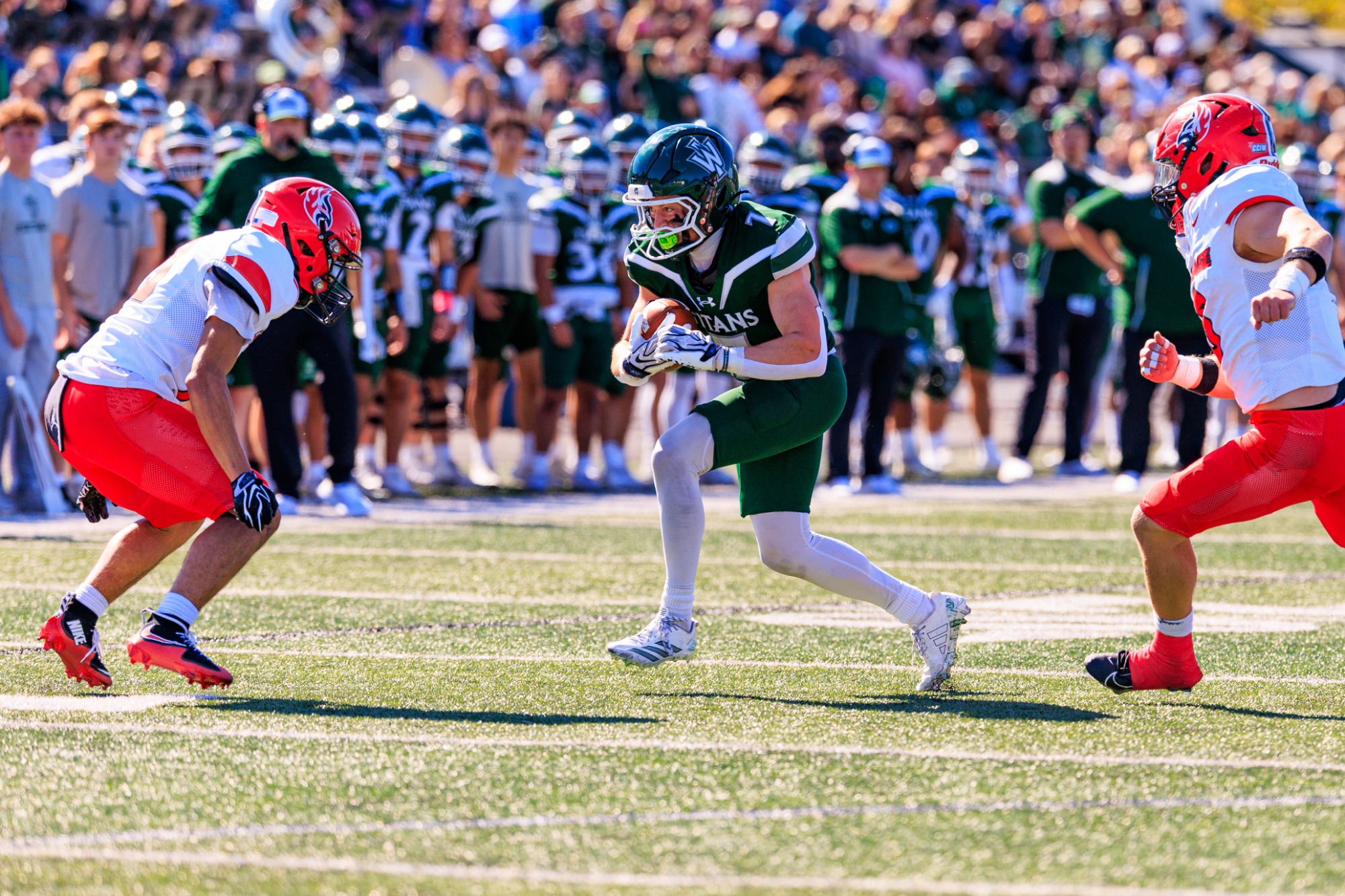 BLOOMINGTON, Ill. - In a picture-perfect Homecoming Saturday at Tucci Stadium, the Illinois Wesleyan University provided a packed stadium with plenty to celebrate as the Titans soared to a 34-14 win over Carthage College, Oct. 3. With the win, the Green and White bumped its record to 4-1 overall and 1-1 in College Conference of Illinois and Wisconsin play. The Firebirds fell to 1-3 (0-2 CCIW) with the setback.