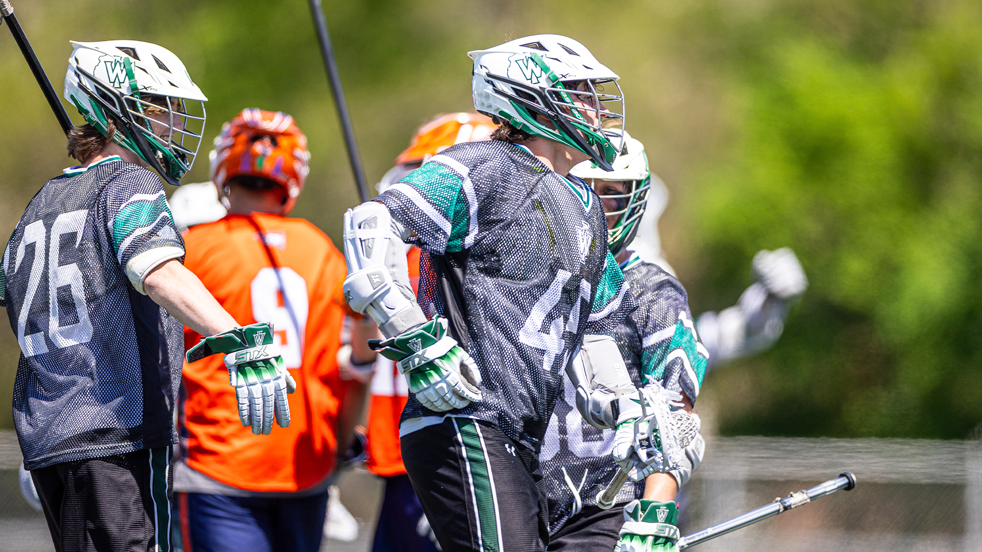 Jarett Brunson and Ethan Canavaugh celebrating a goal against Carroll April 26, 2025