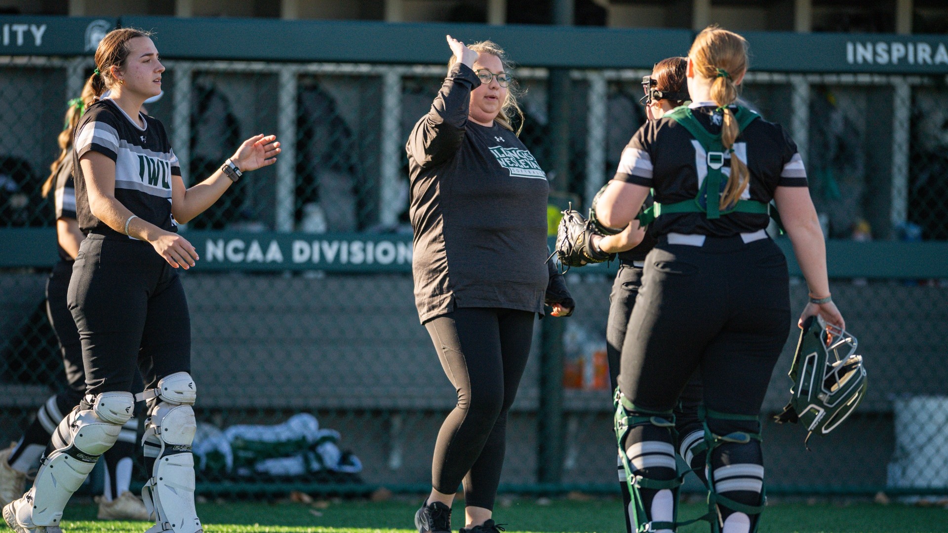 Nikki Miller high-fiving Titans coming off the field