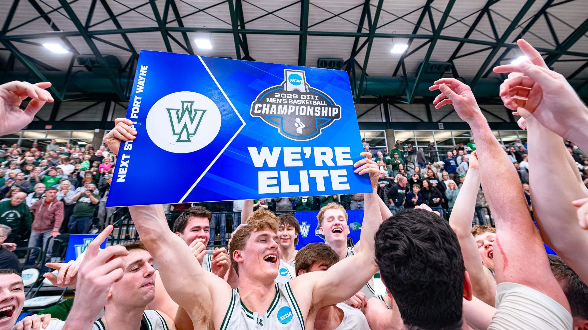 We're Elite - Men's basketball celebrating postgame