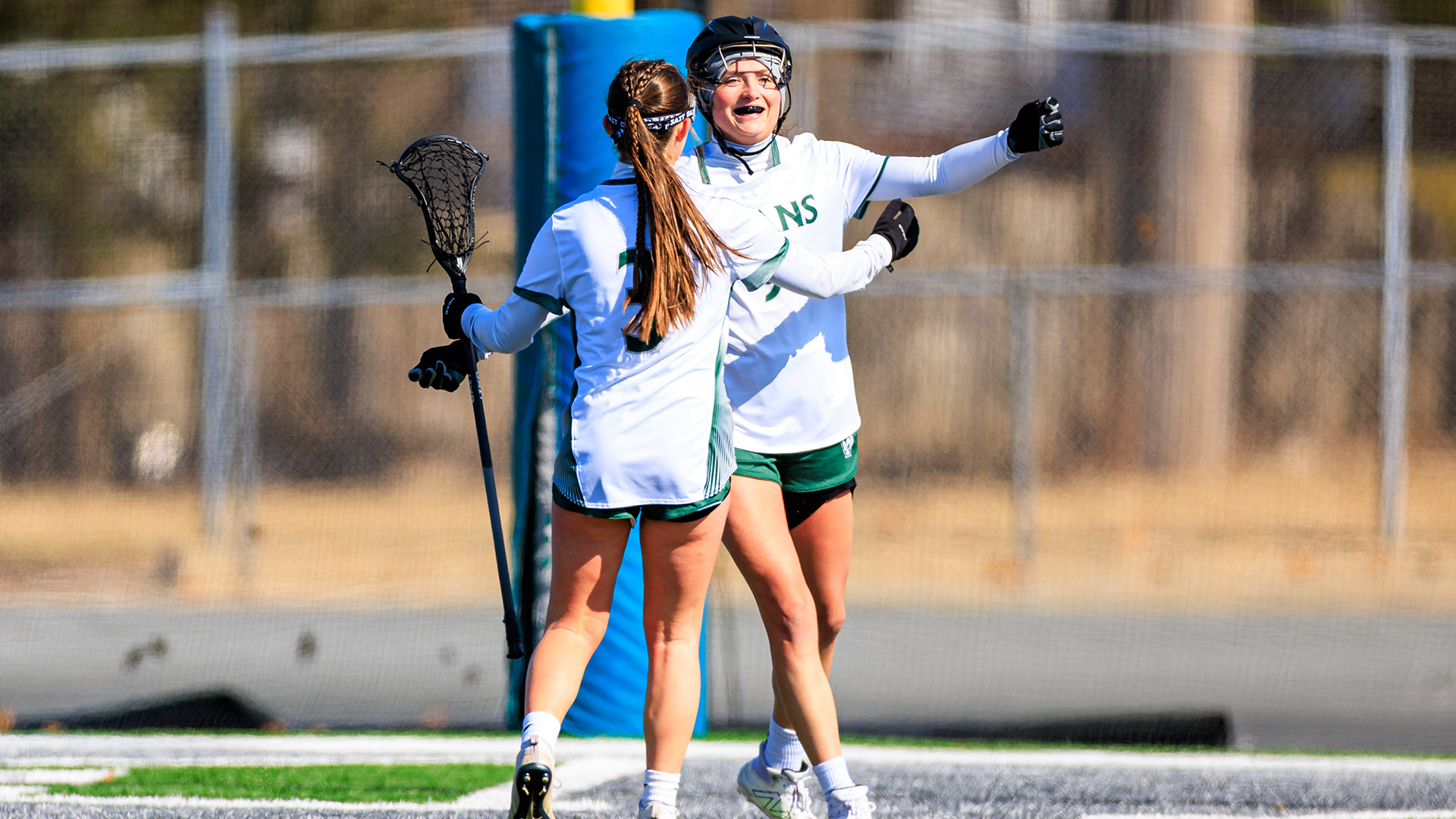 Anelise DiGiovanni and Maddie Gibson celebrating a goal against IIT Feb. 21, 2026