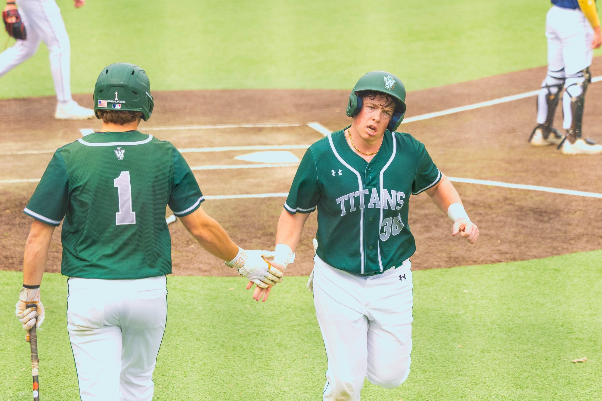 Photos from Game 3 of a three-game series between the Illinois Wesleyan Titans and the UW–Oshkosh Titans on March 22, 2026. 