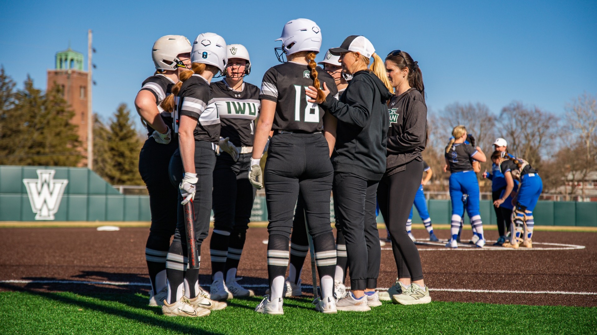 Team huddling before hitting