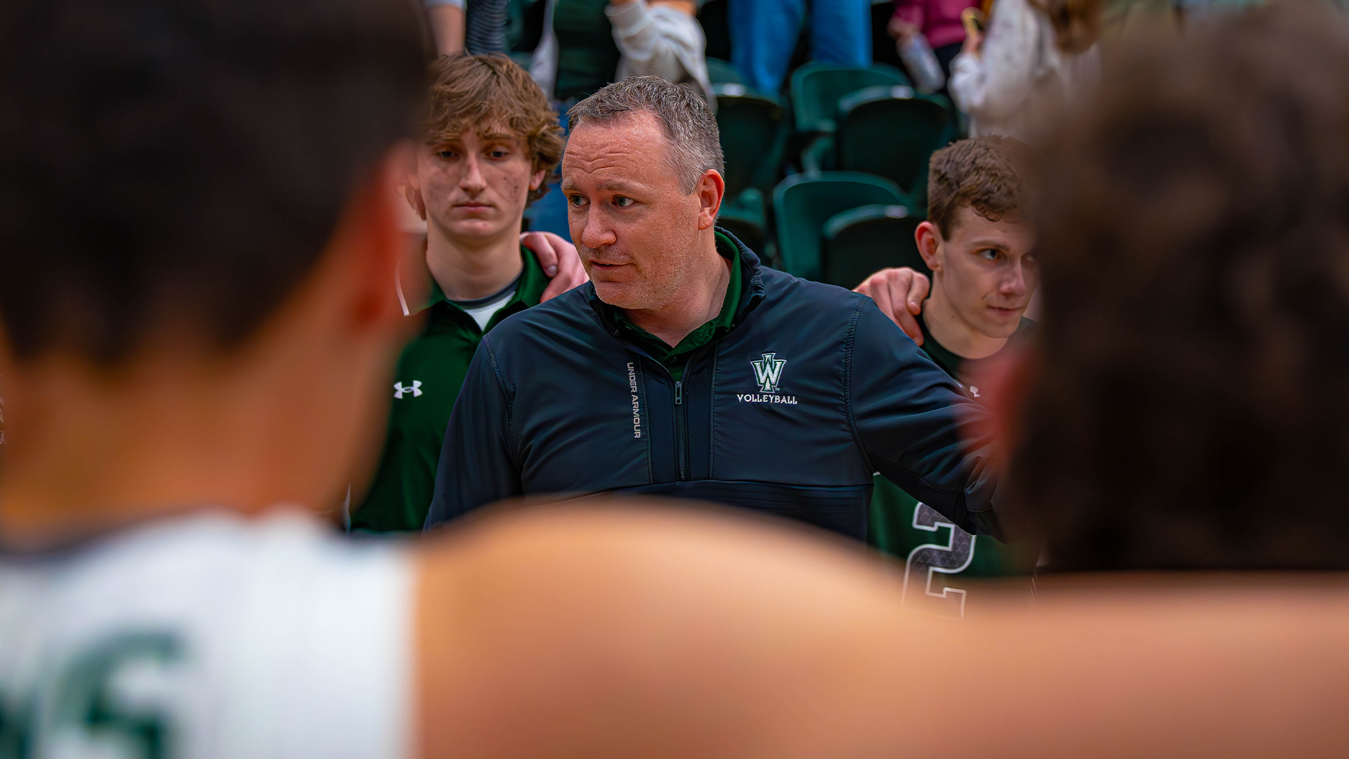 Brandon Mueller in a huddle against Loras March 25, 2026