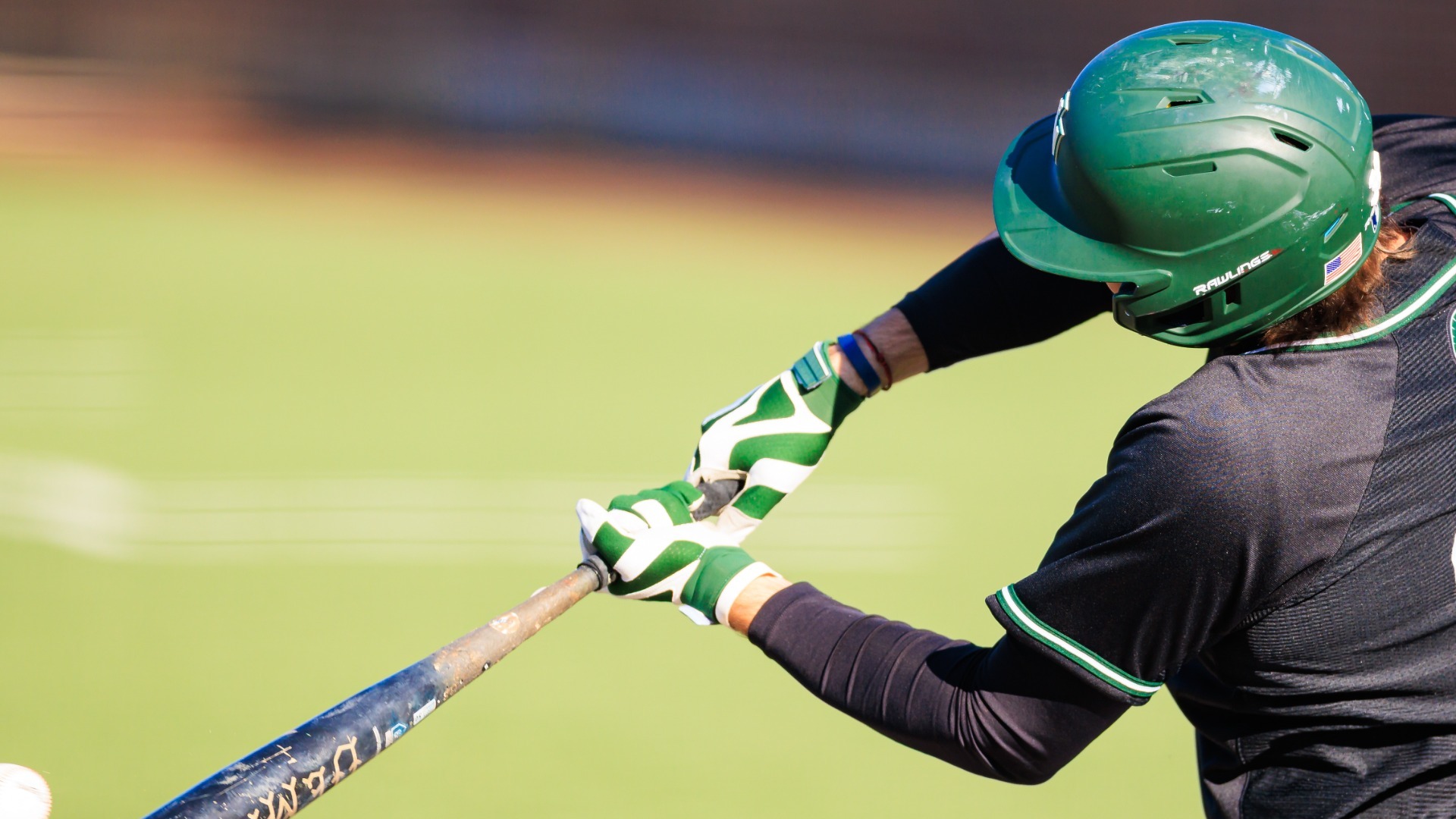 Baseball swinging a bat