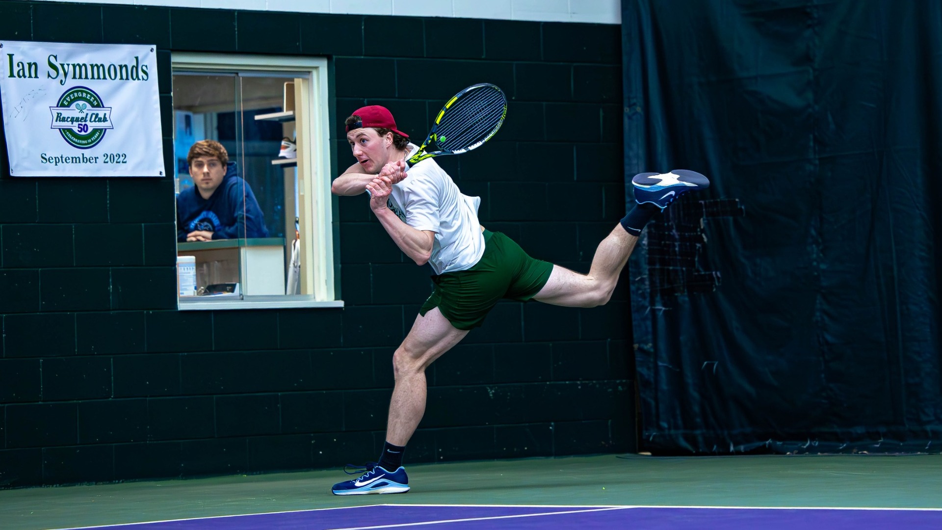 Ben Vigneri returning a shot against Lawrence March 8, 2026