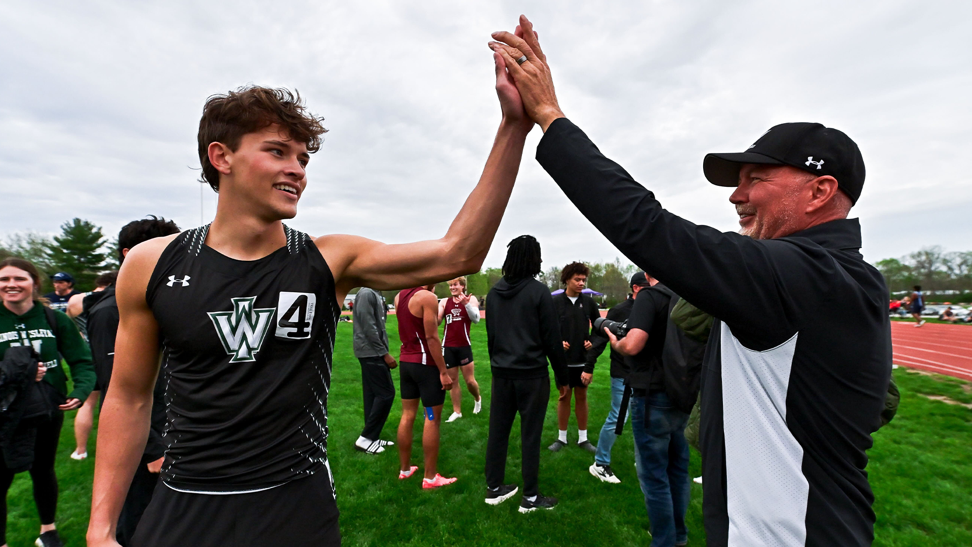 Alex Maas and Coach Lowder high-fiving at Greenville Select 4-11-2026