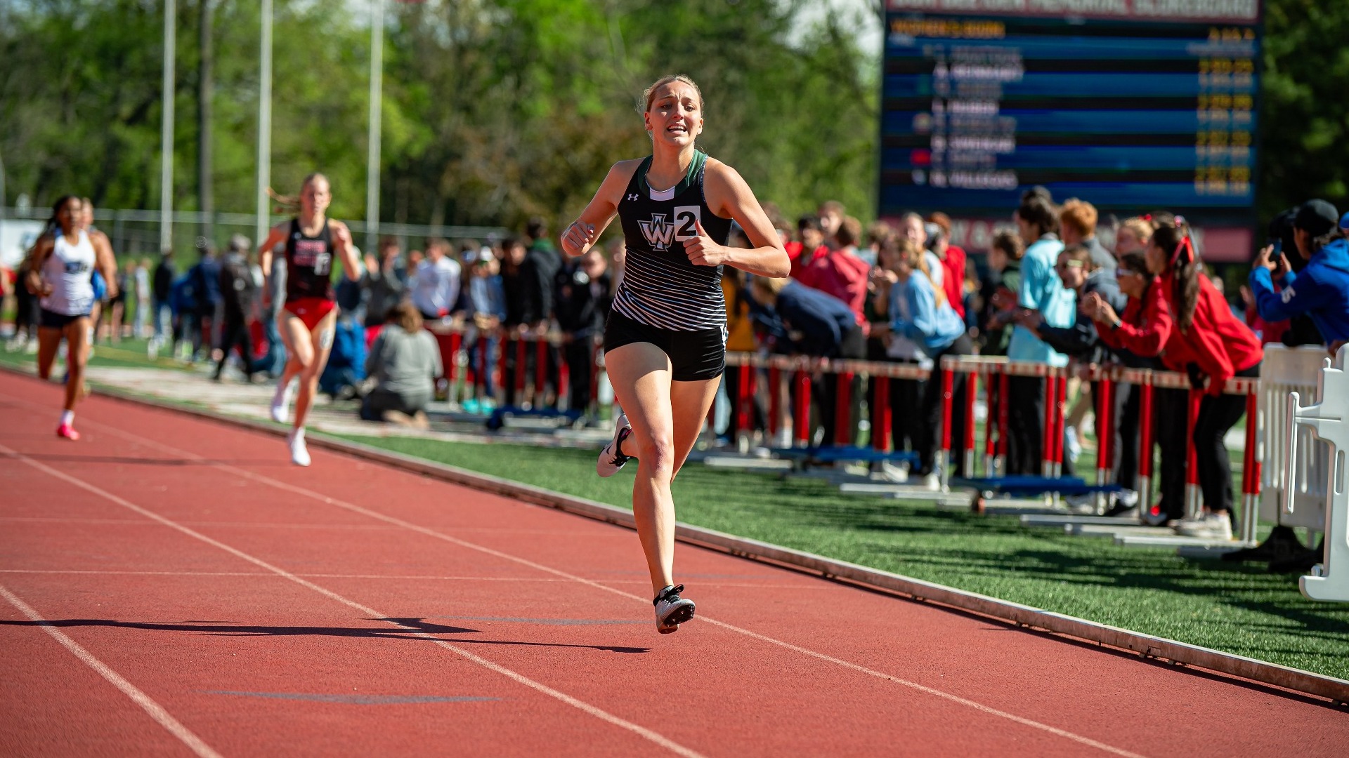 Mackenzie Huber running at 2025 CCIW Outdoor Championship