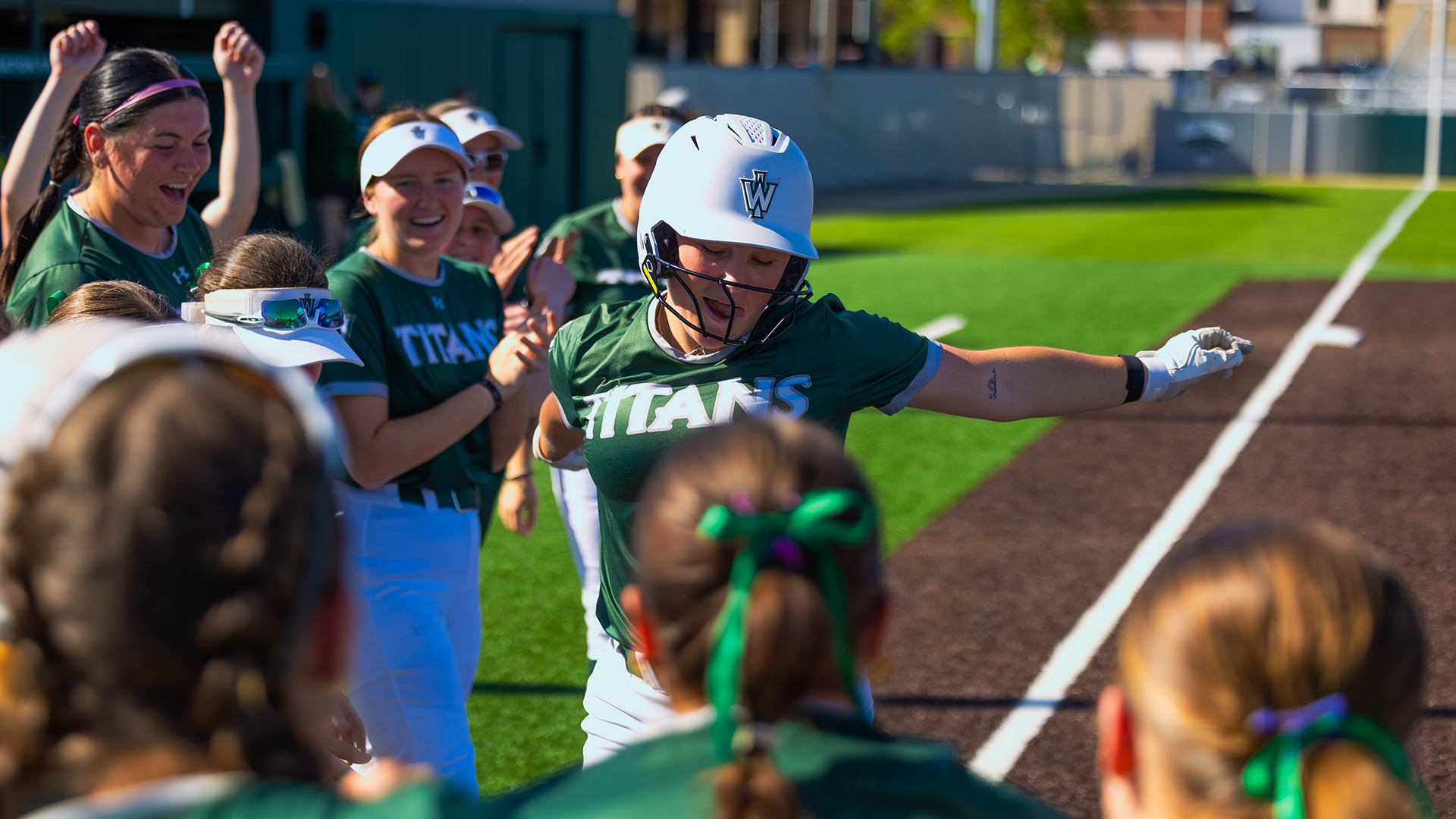 Casey Wissmiller griddying into home plate after hitting a homerun