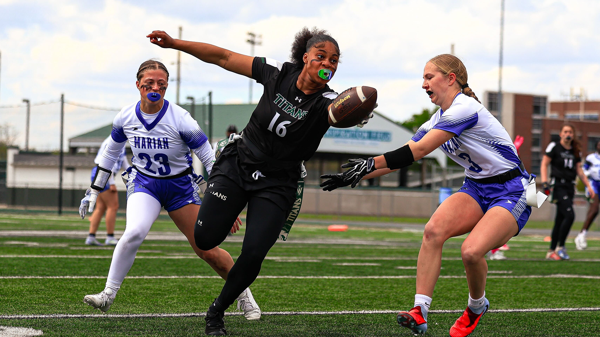 Natalyia Stallings stretching with the ball against Marian April 19, 2026