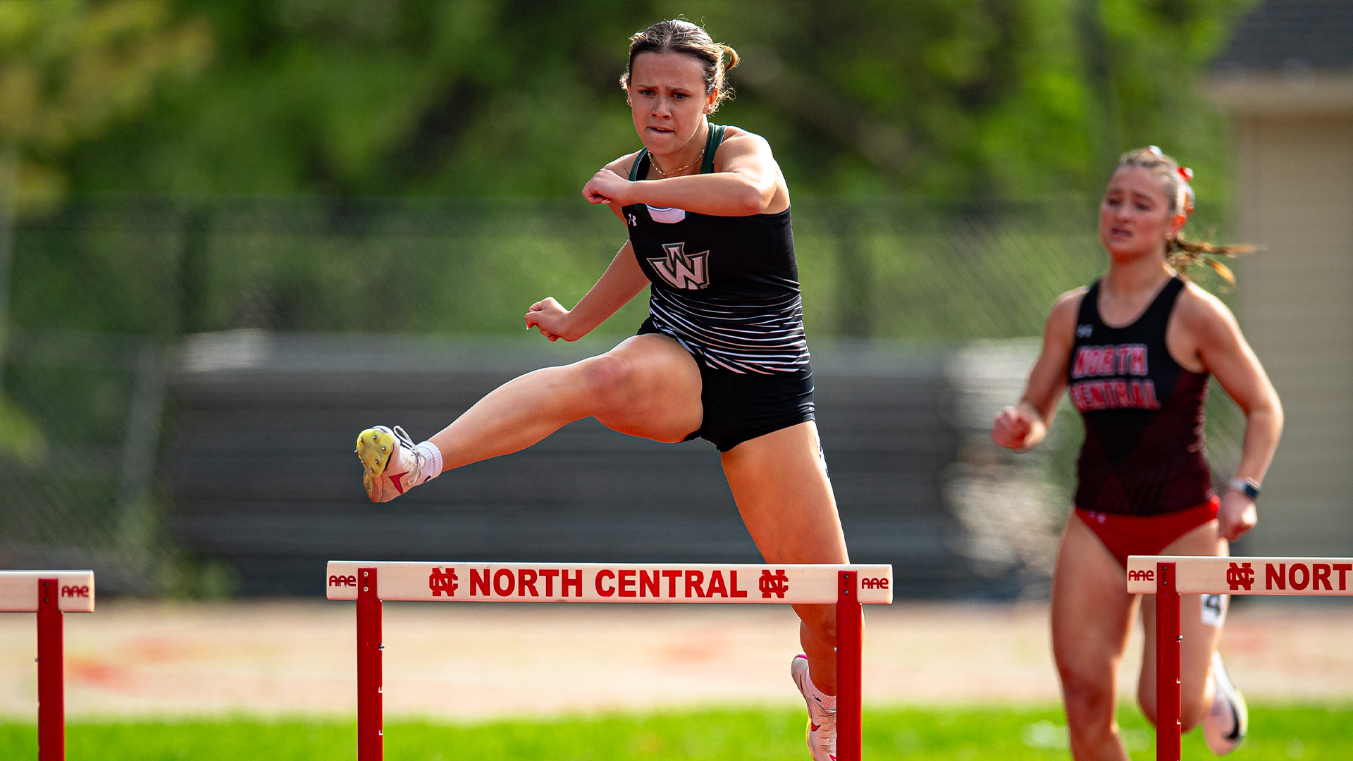 Kelsey Moore Running 400m hurdles at CCIW Outdoor Championships