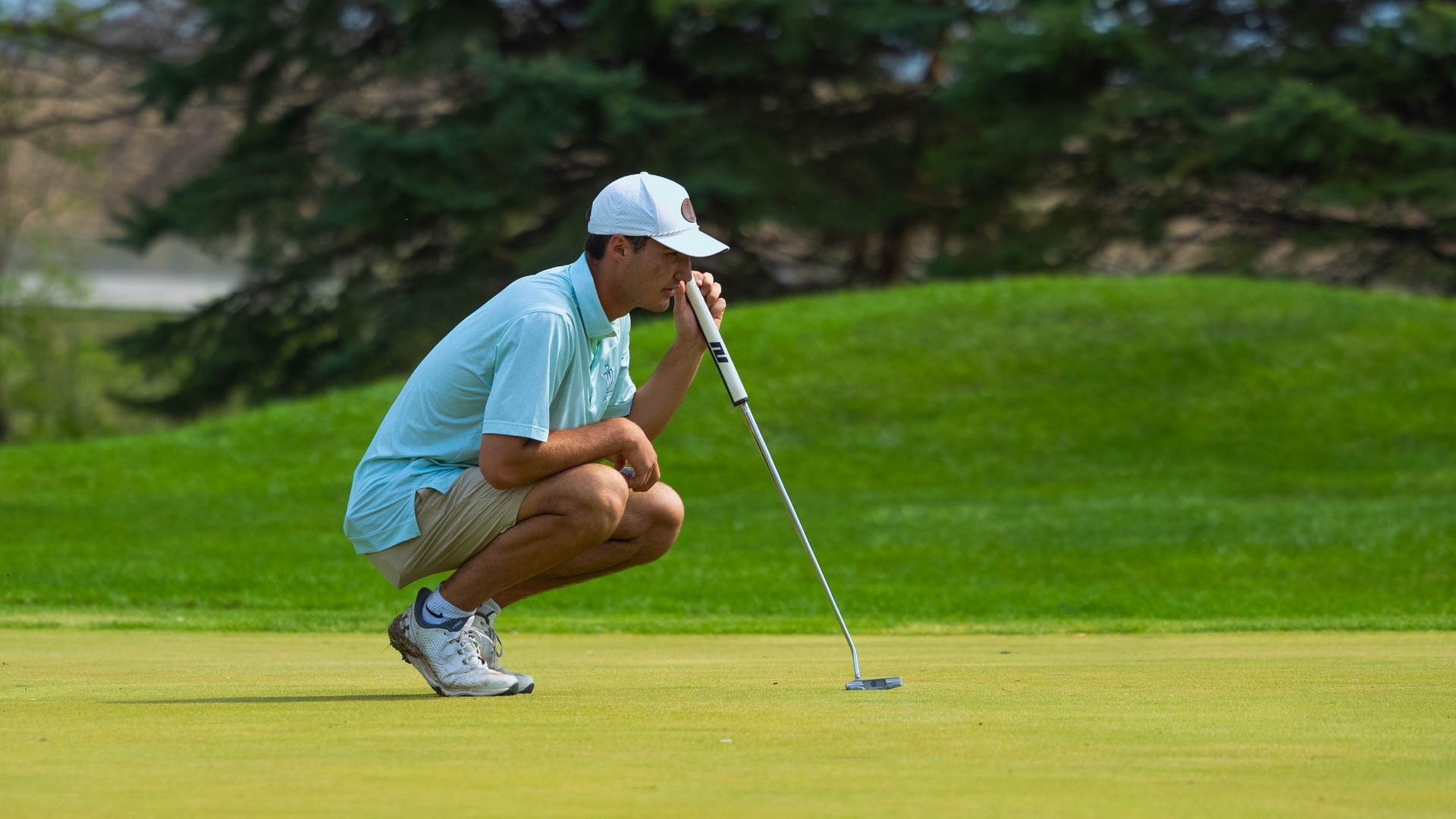 IWU Men's Golf at the IWU Spring Invite, April 3 2026, Myles Lahart Lining Up a Putt