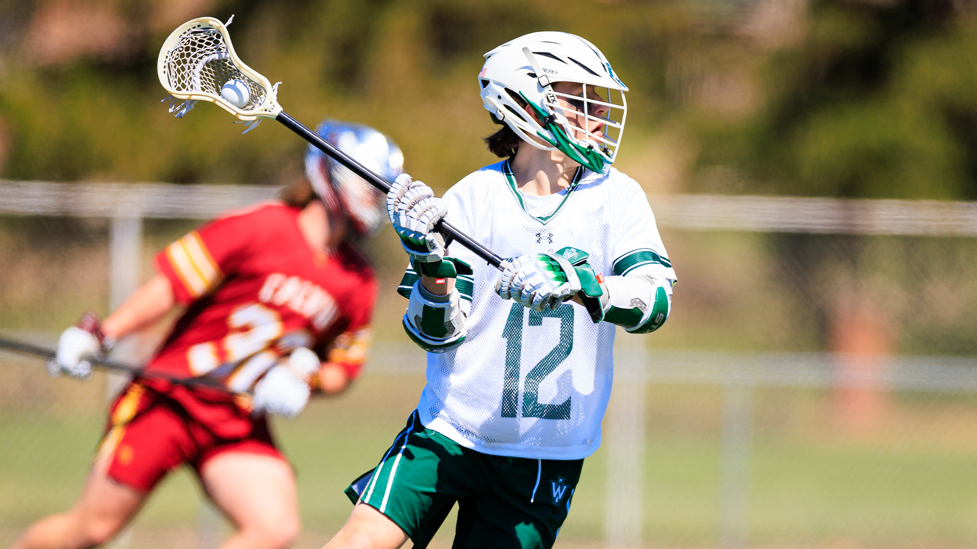 Charlie Burghardt with the ball against Calvin March 28, 2026