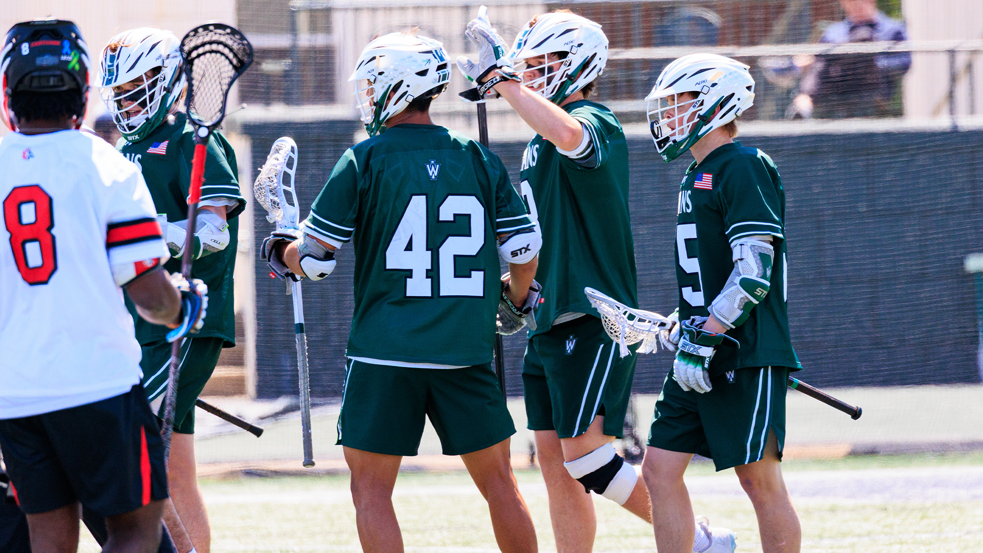 Men's Lacrosse celebrating a goal against Carthage April 18, 2026