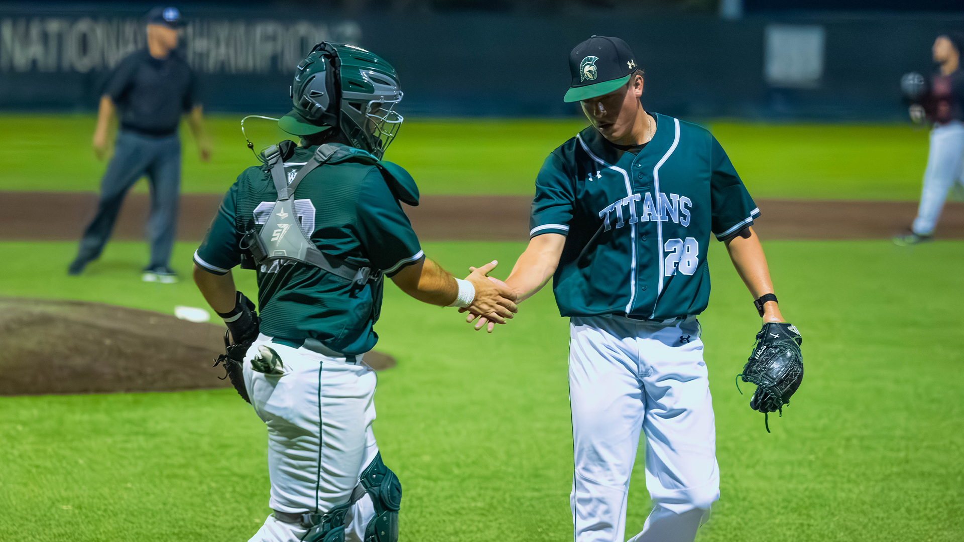 Sean Hollendoner and Luca Morelli slap hands 