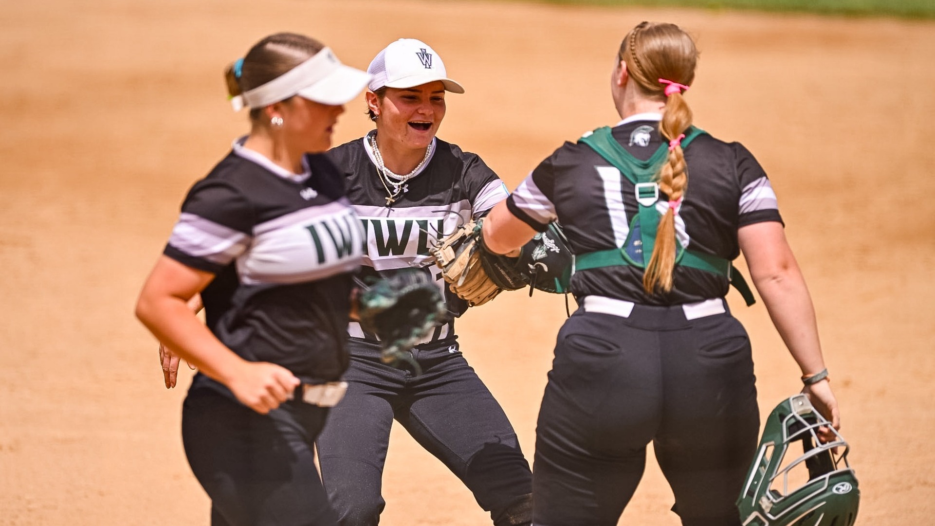 Anna Beckman, Casey Wissmiller, & Claire Post celebrate an out
