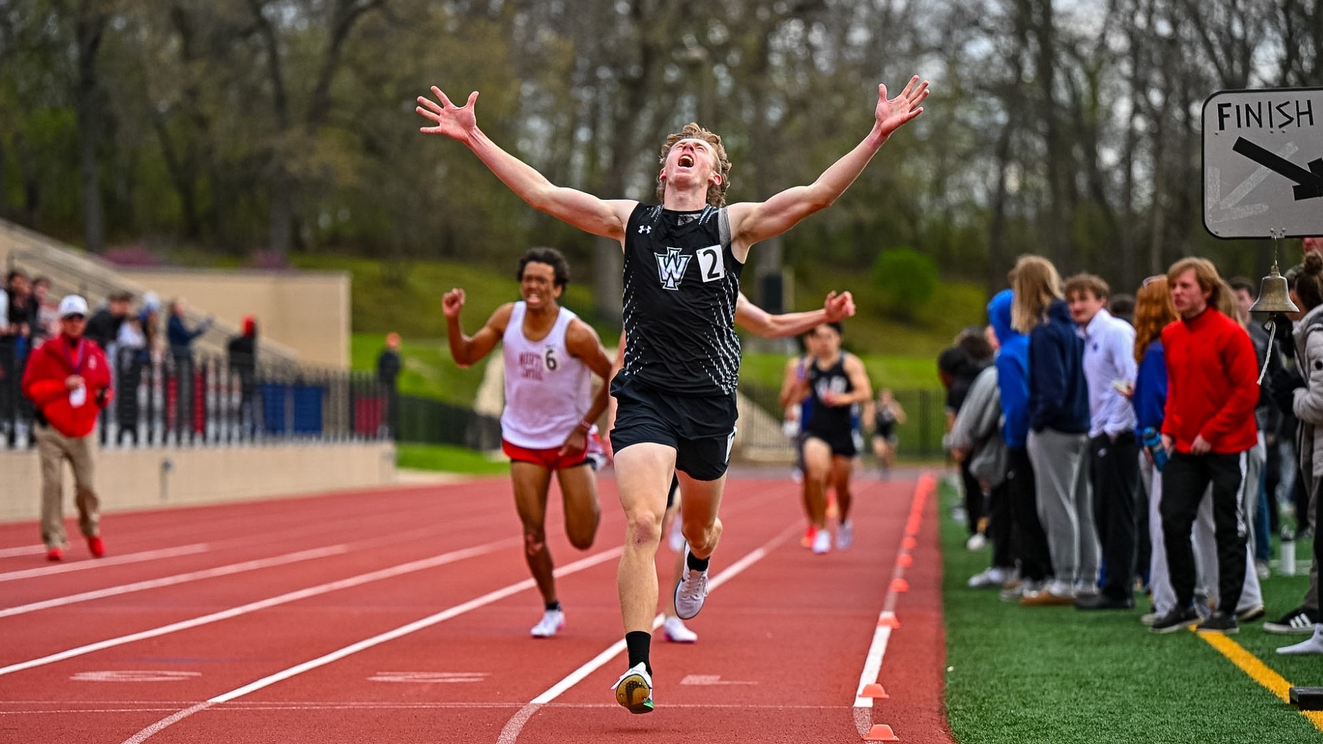 Jacob Pinkston celebrates winning 800m at 2026 CCIW Championships