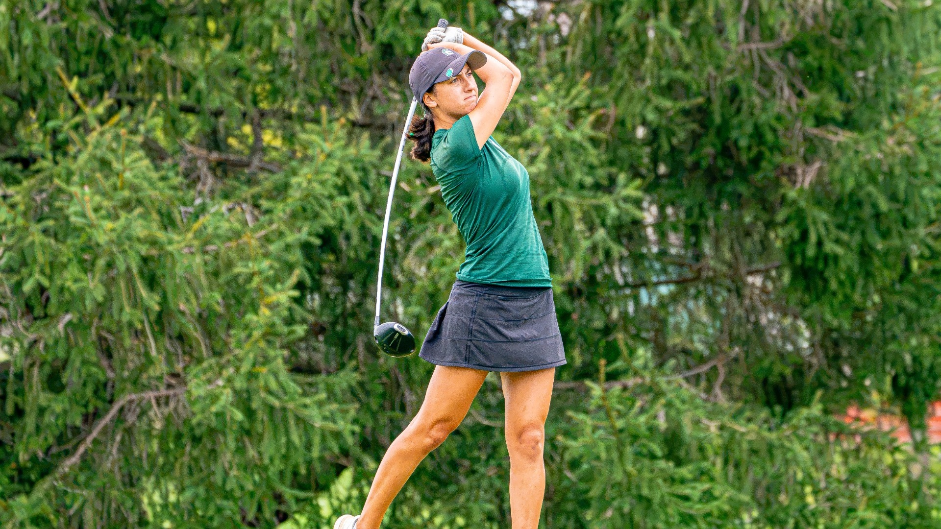 GiGi Zera swinging a club