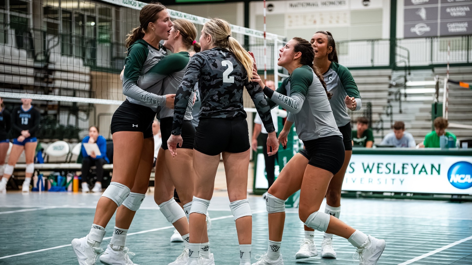 Whitaker cheers with teammates