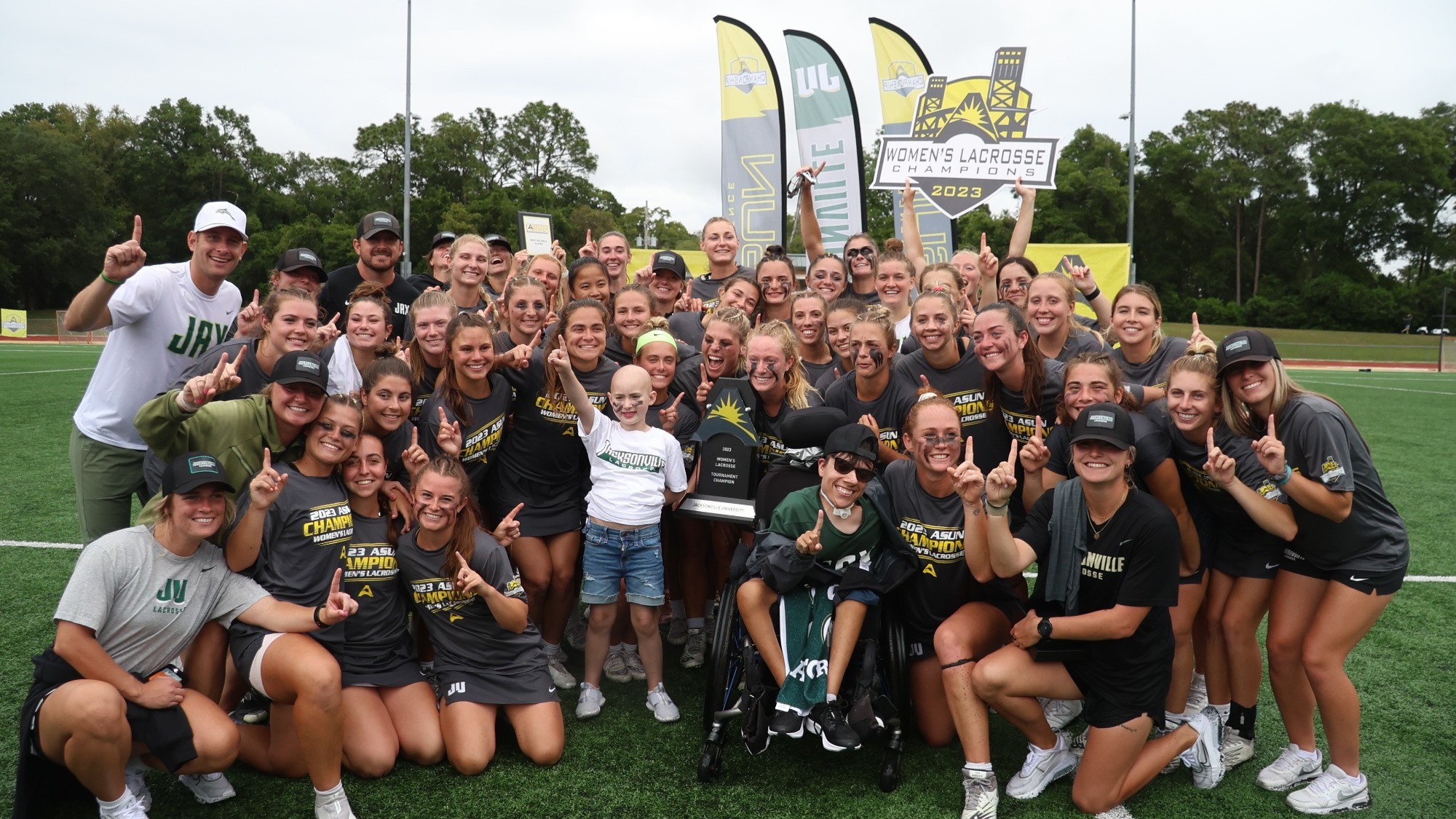 WLAX celebrating with whole team and trophy 2023 ASUN Championship